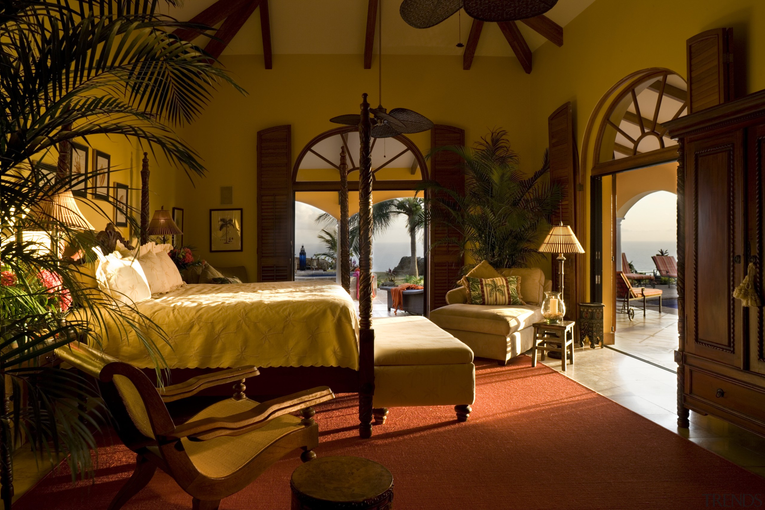 Interior view of this bedroom which features warm bedroom, ceiling, estate, hacienda, home, hotel, interior design, room, suite, brown, red