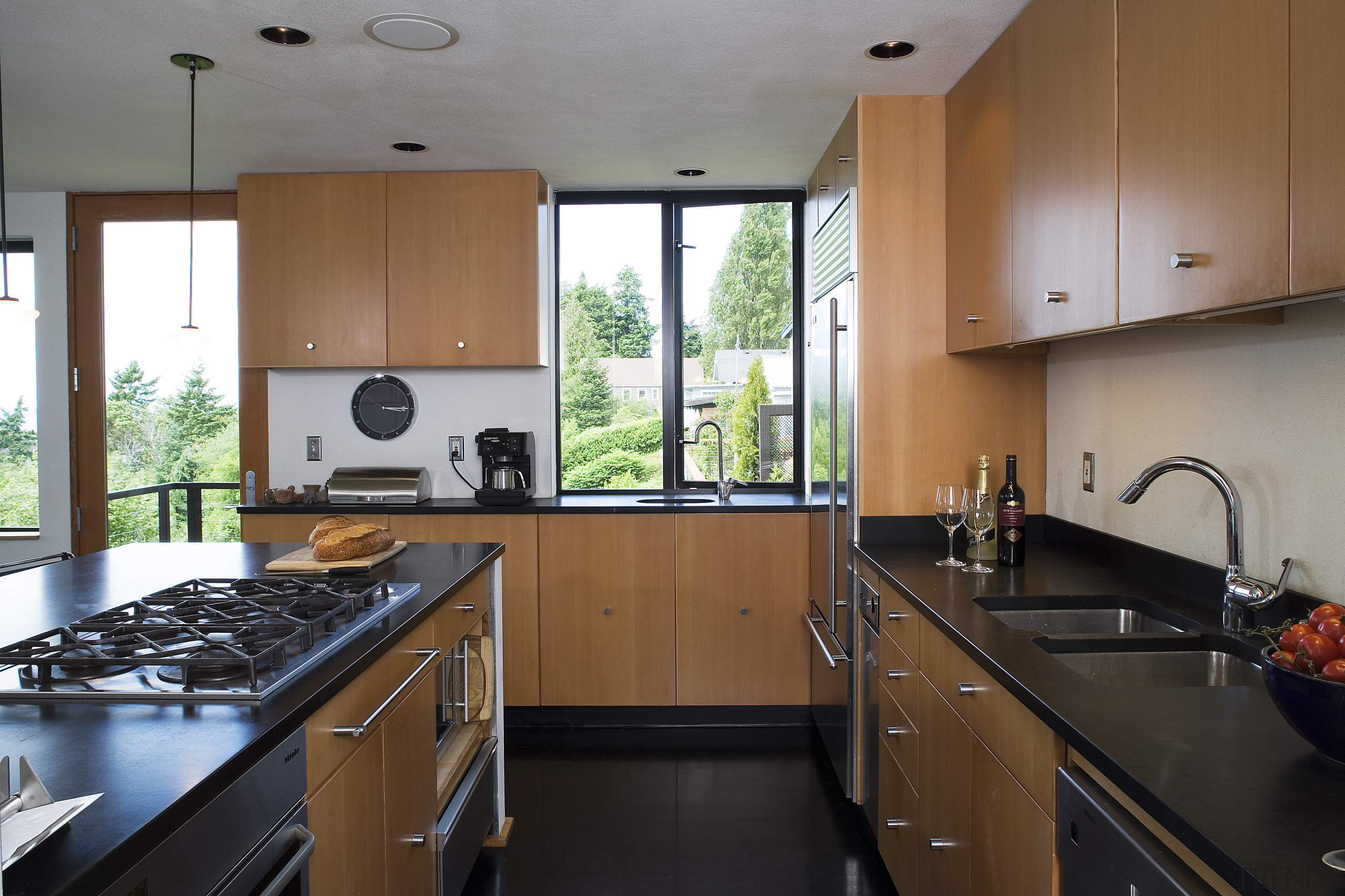 view of the kitchen featuring stainlees steel sink/kitchen cabinetry, countertop, interior design, kitchen, property, real estate, room, brown, black