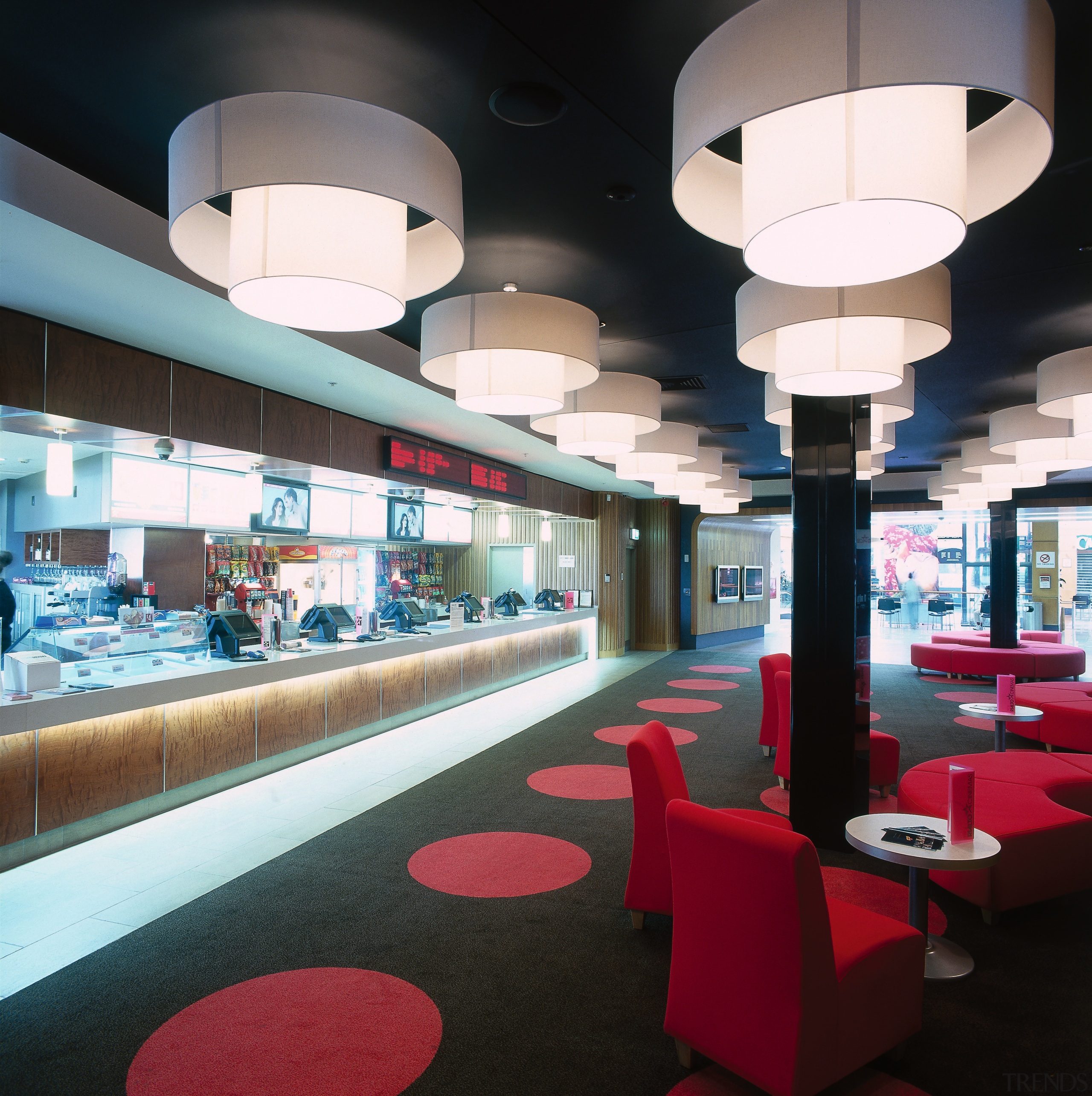 Theatre lobby with black and red carpet, black architecture, ceiling, interior design, lobby, table, black