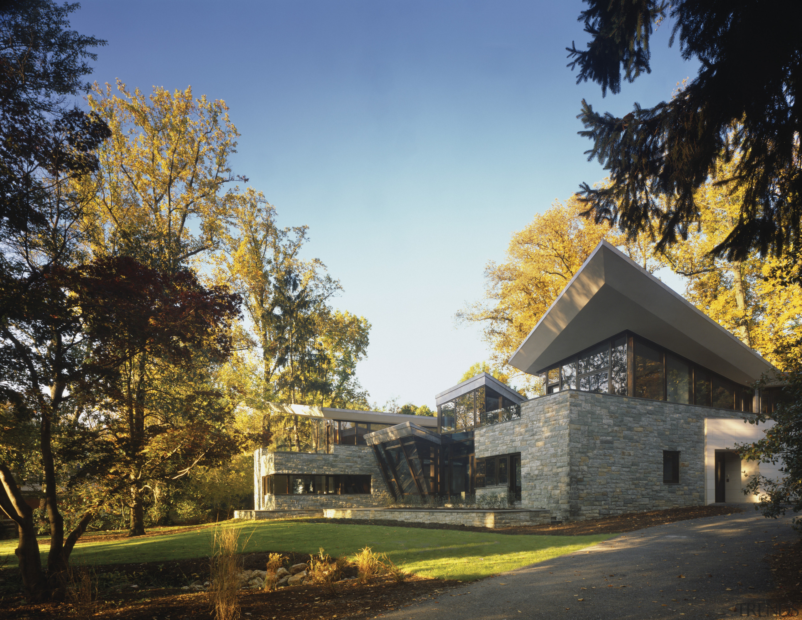 Exterior view of this new home which was architecture, autumn, cloud, cottage, estate, farmhouse, home, house, landscape, leaf, morning, nature, plant, property, real estate, residential area, sky, suburb, sunlight, tree, black