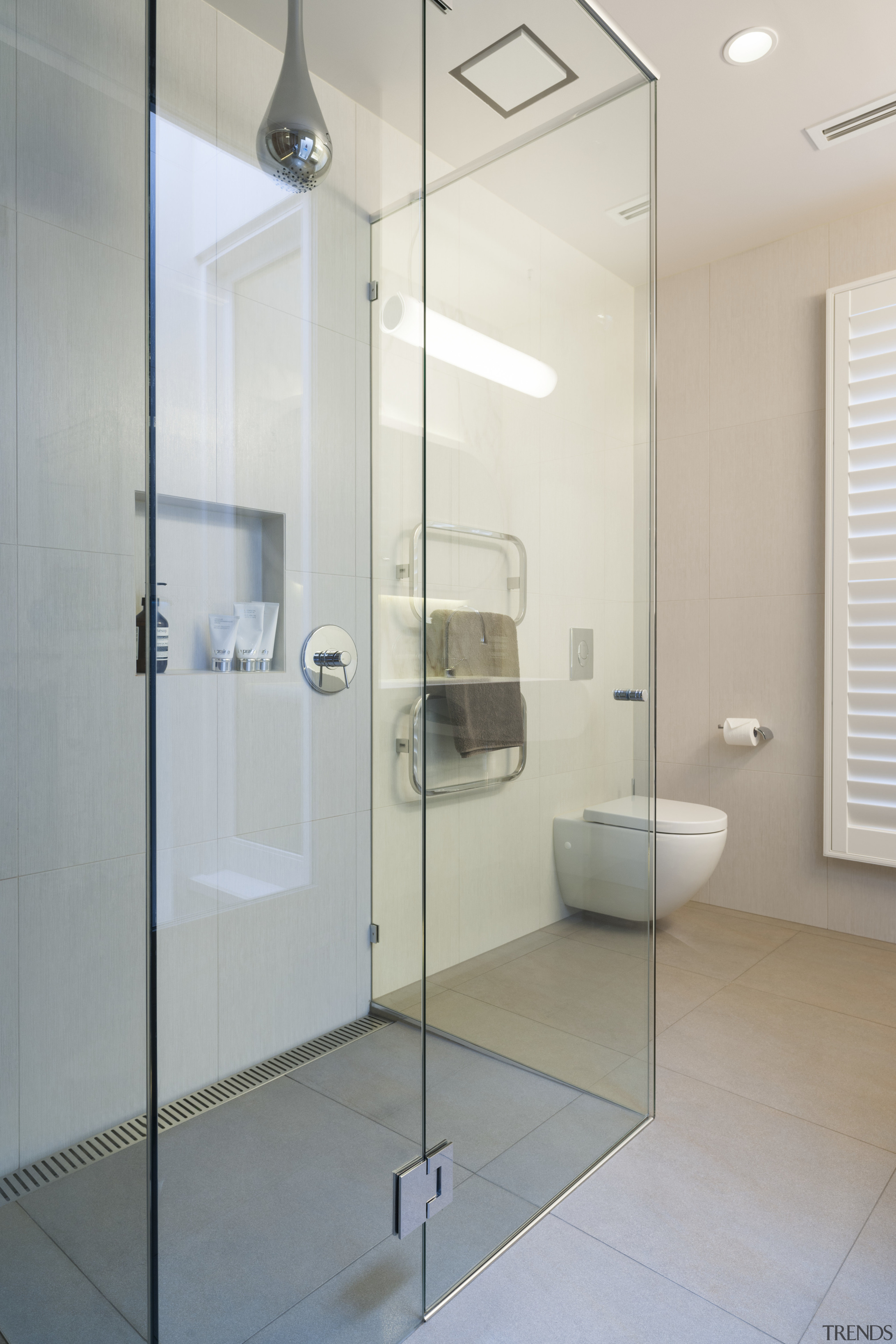 A glass shower enclosure adds to this bathrooms bathroom, glass, interior design, plumbing fixture, product design, room, shower, tap, gray