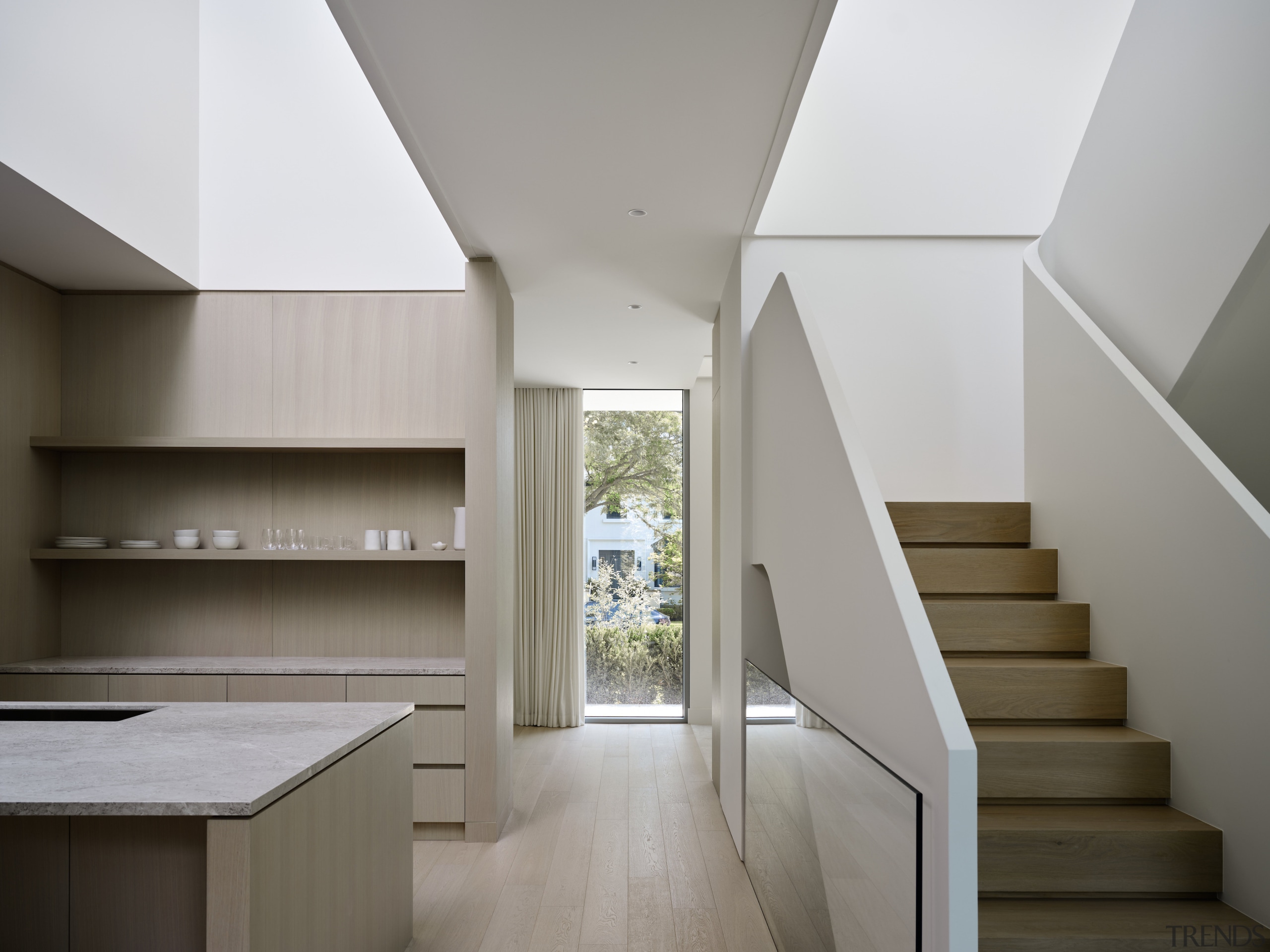 Kitchen, floor-to-ceiling window and feature stairs. 