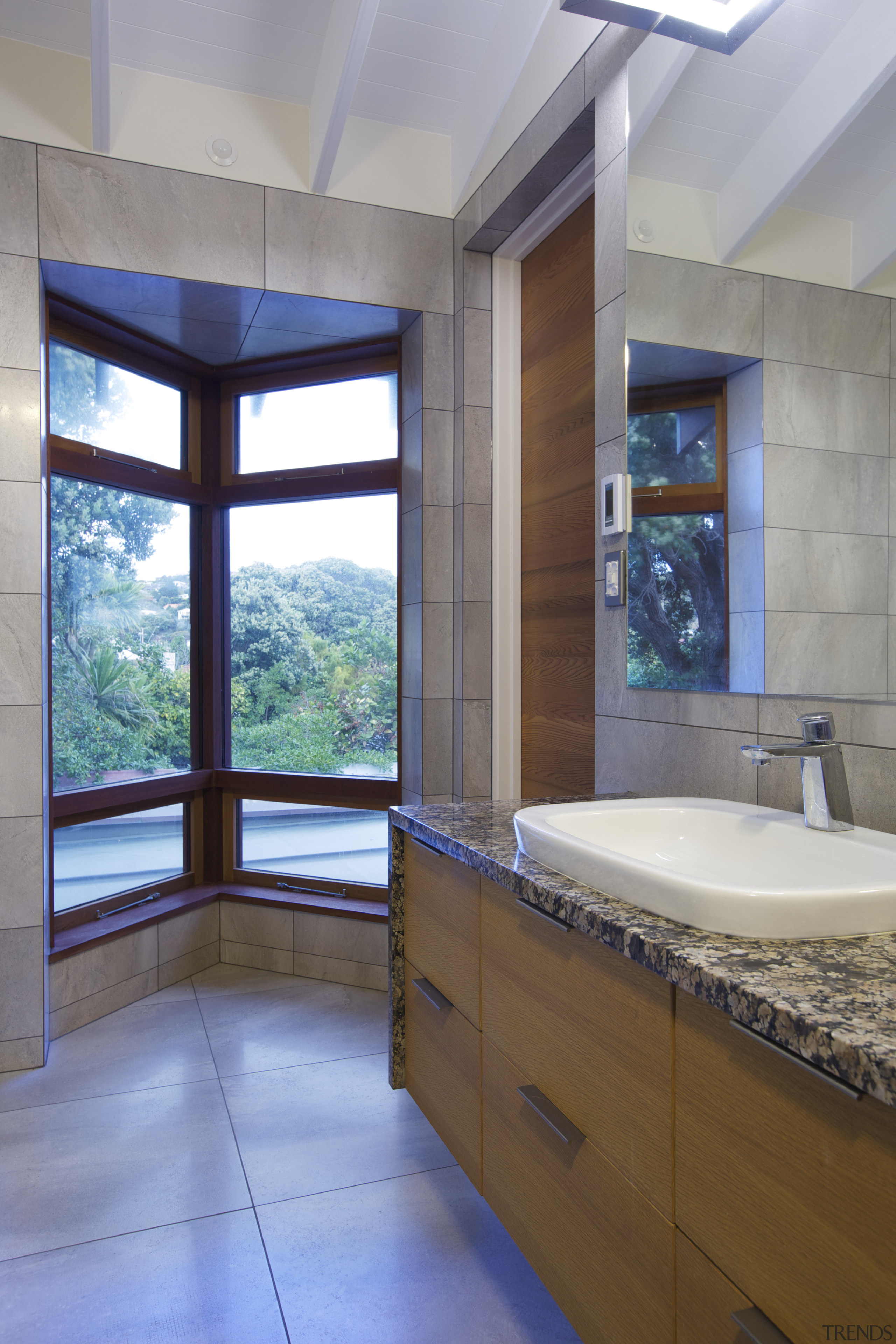 In the bathroom of this coastal home a architecture, bathroom, ceiling, countertop, daylighting, estate, home, interior design, real estate, room, window, gray