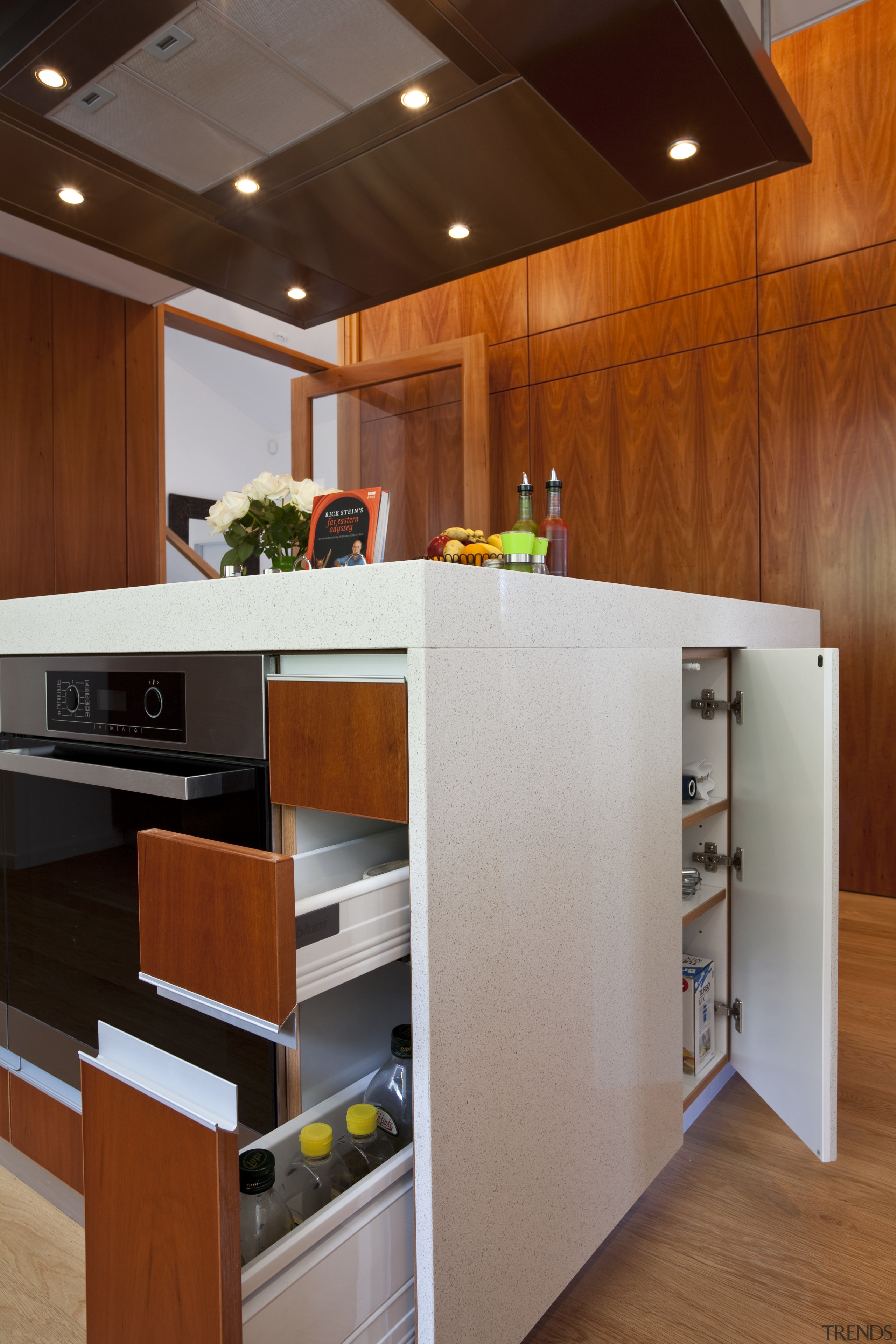 View of kitchen which features oak floors, kitchen cabinetry, countertop, floor, hardwood, interior design, kitchen, brown, gray