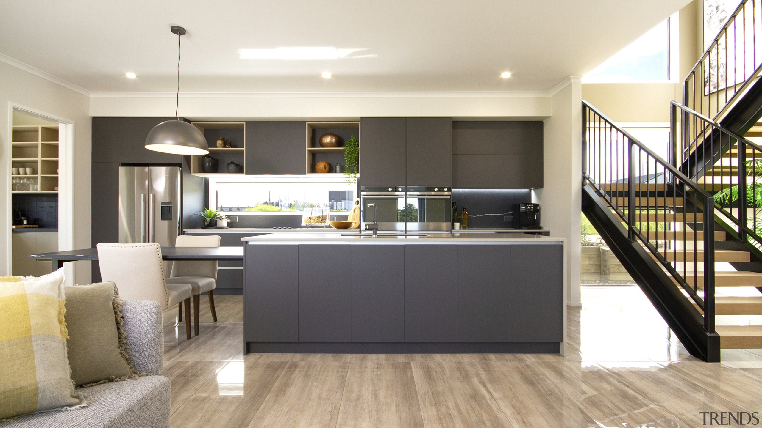 Refined matt cabinetry, a window splashback, generous island 