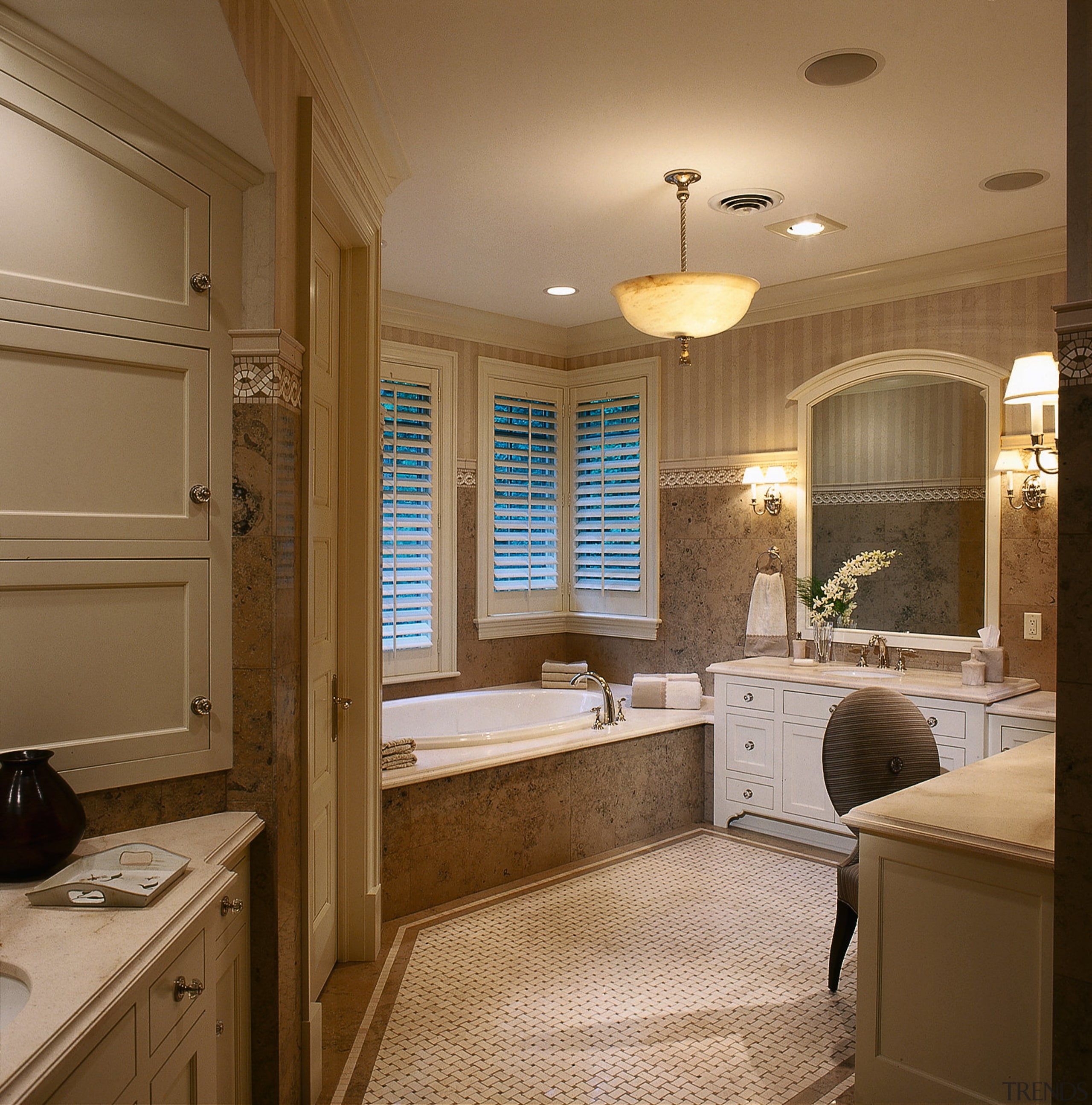 view of the master bathroom with a tray bathroom, cabinetry, ceiling, countertop, floor, home, interior design, room, sink, window, brown