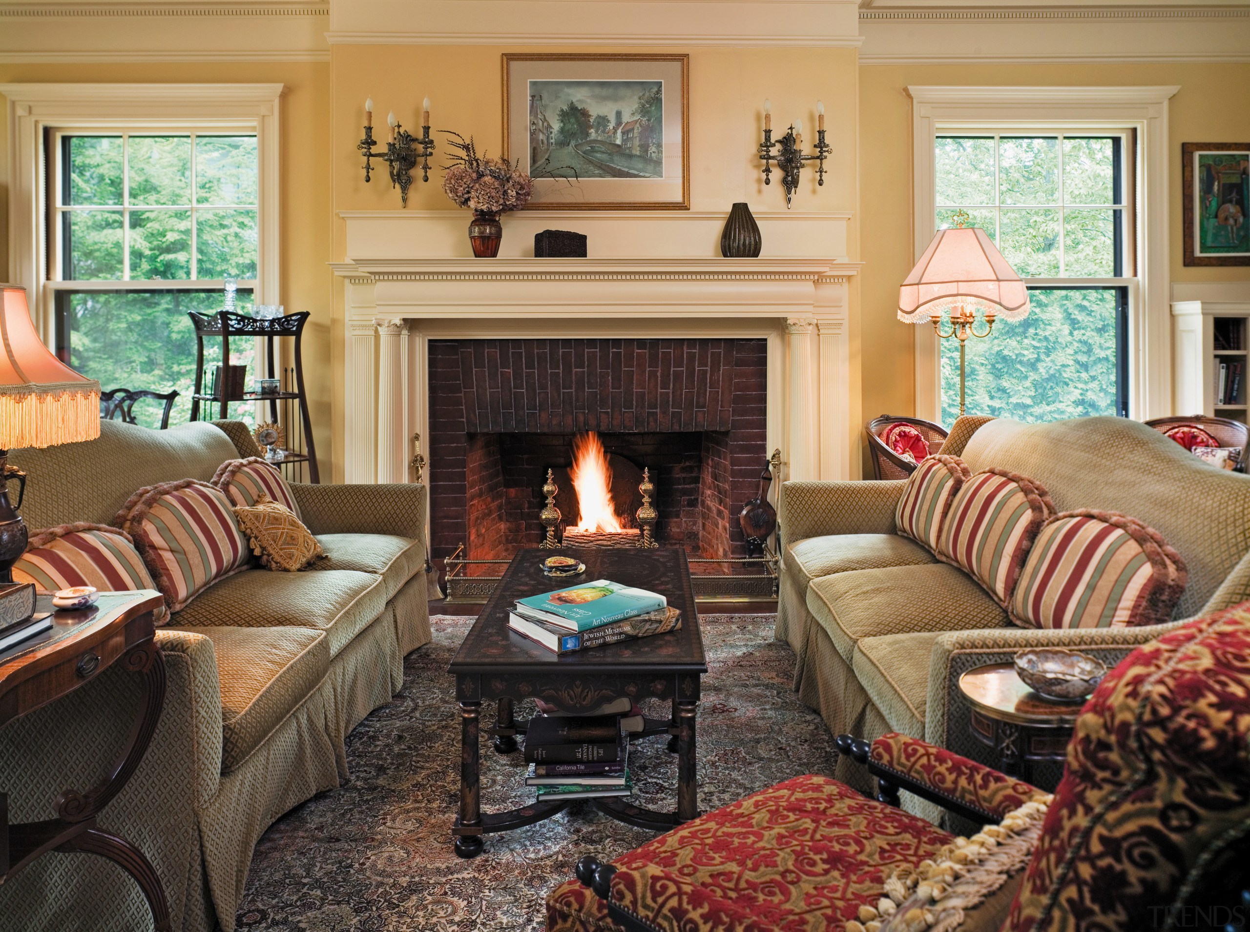 view of the formail living room that features couch, fireplace, hearth, home, house, interior design, living room, real estate, room, wall, window, orange, black