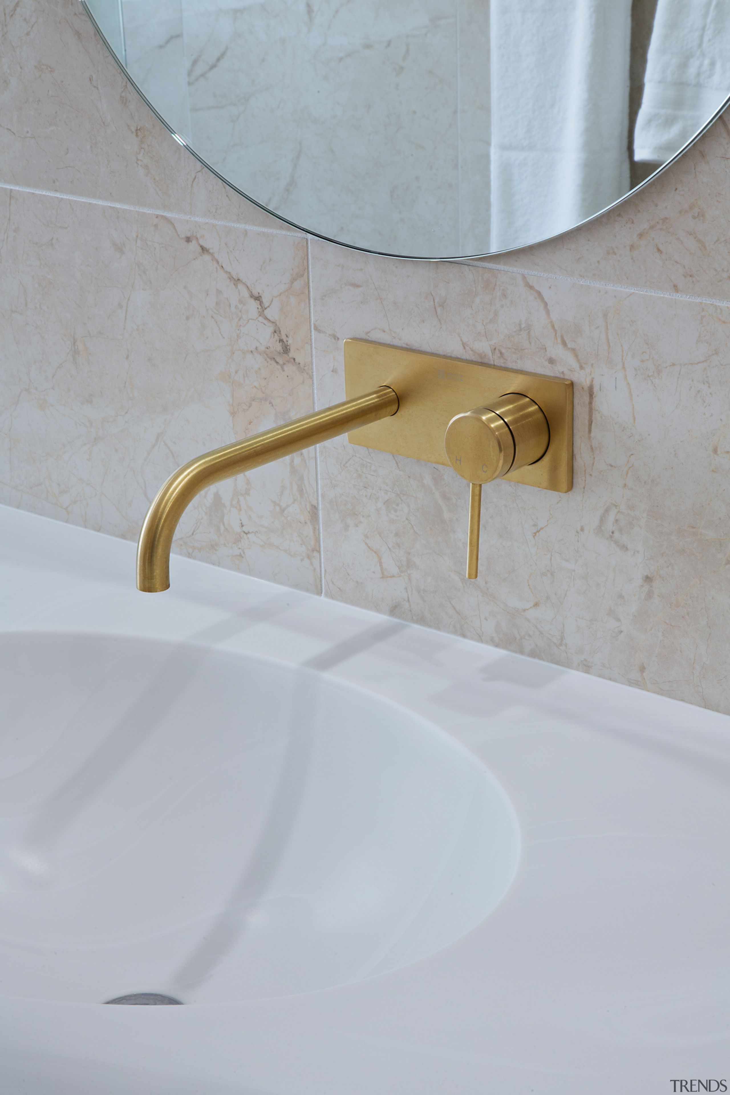 Brushed brass fittings add to the simple, yet 