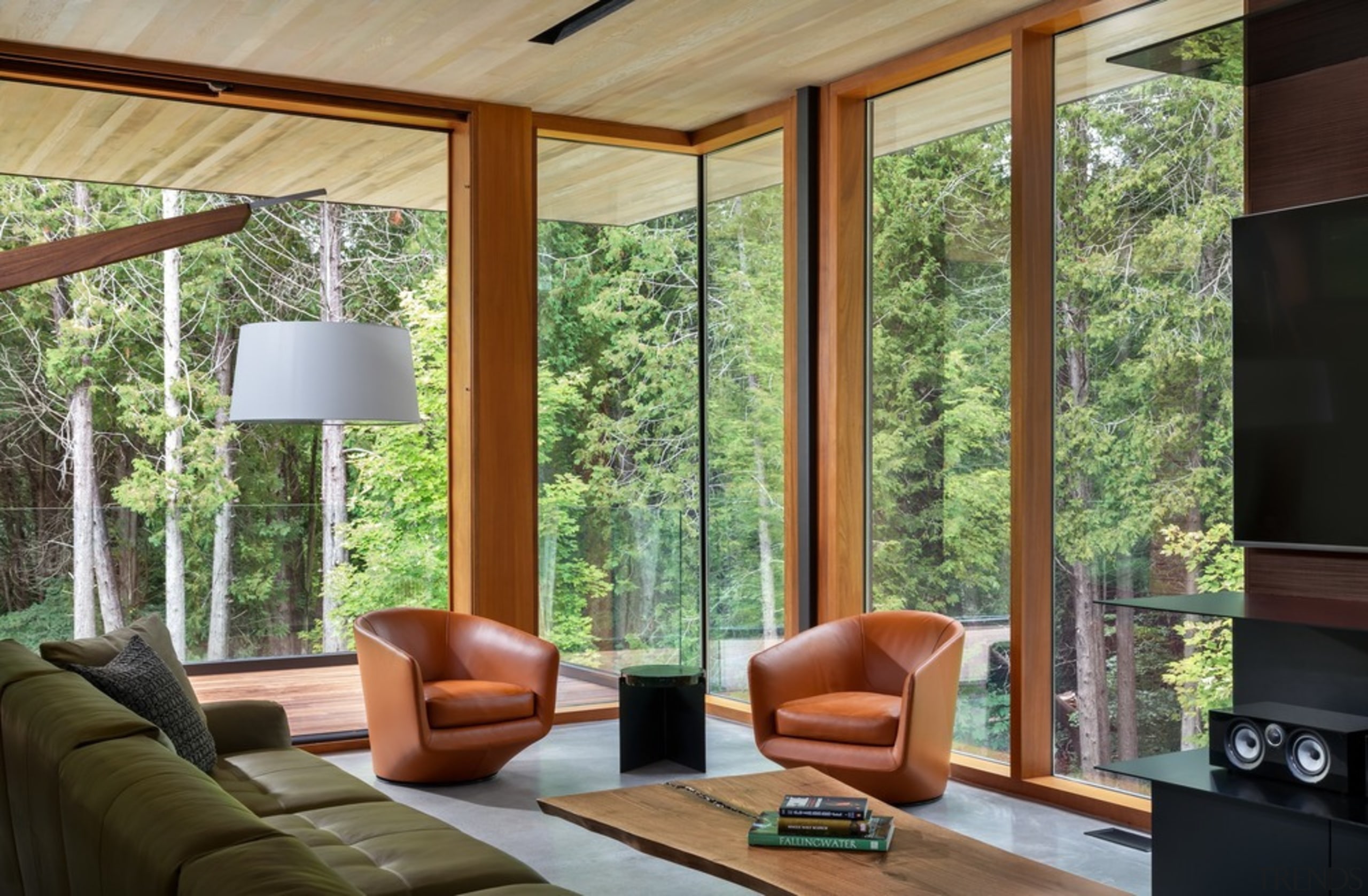 The cozy floating living room with floor to architecture, building, ceiling, coffee table, couch, door, floor, furniture, hardwood, home, house, interior design, living room, property, real estate, room, shade, table, tree, window, wood, brown