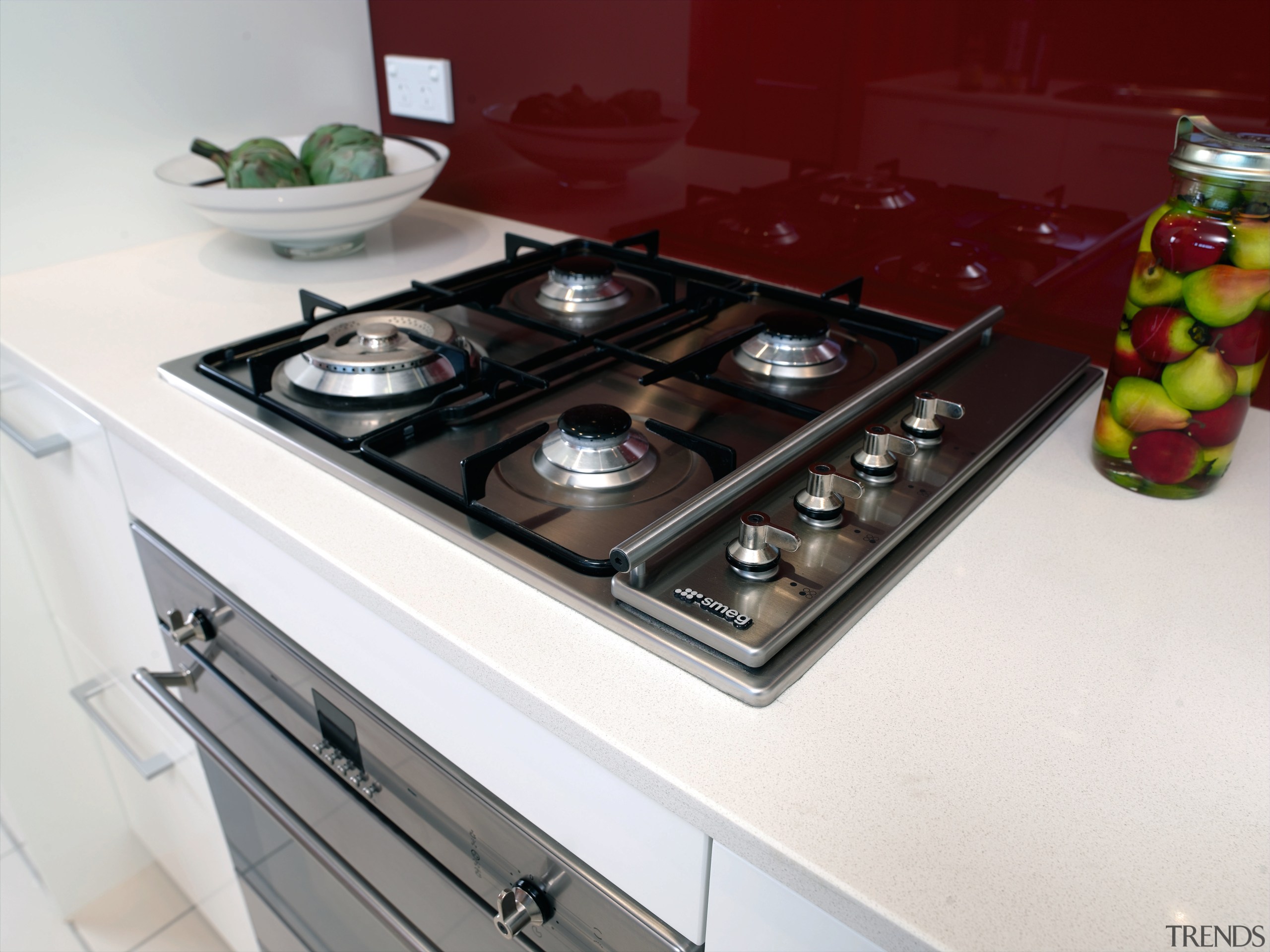 A view of this aprtment kitchen featuring omega cookware and bakeware, countertop, gas stove, home appliance, kitchen, kitchen appliance, kitchen stove, major appliance, white