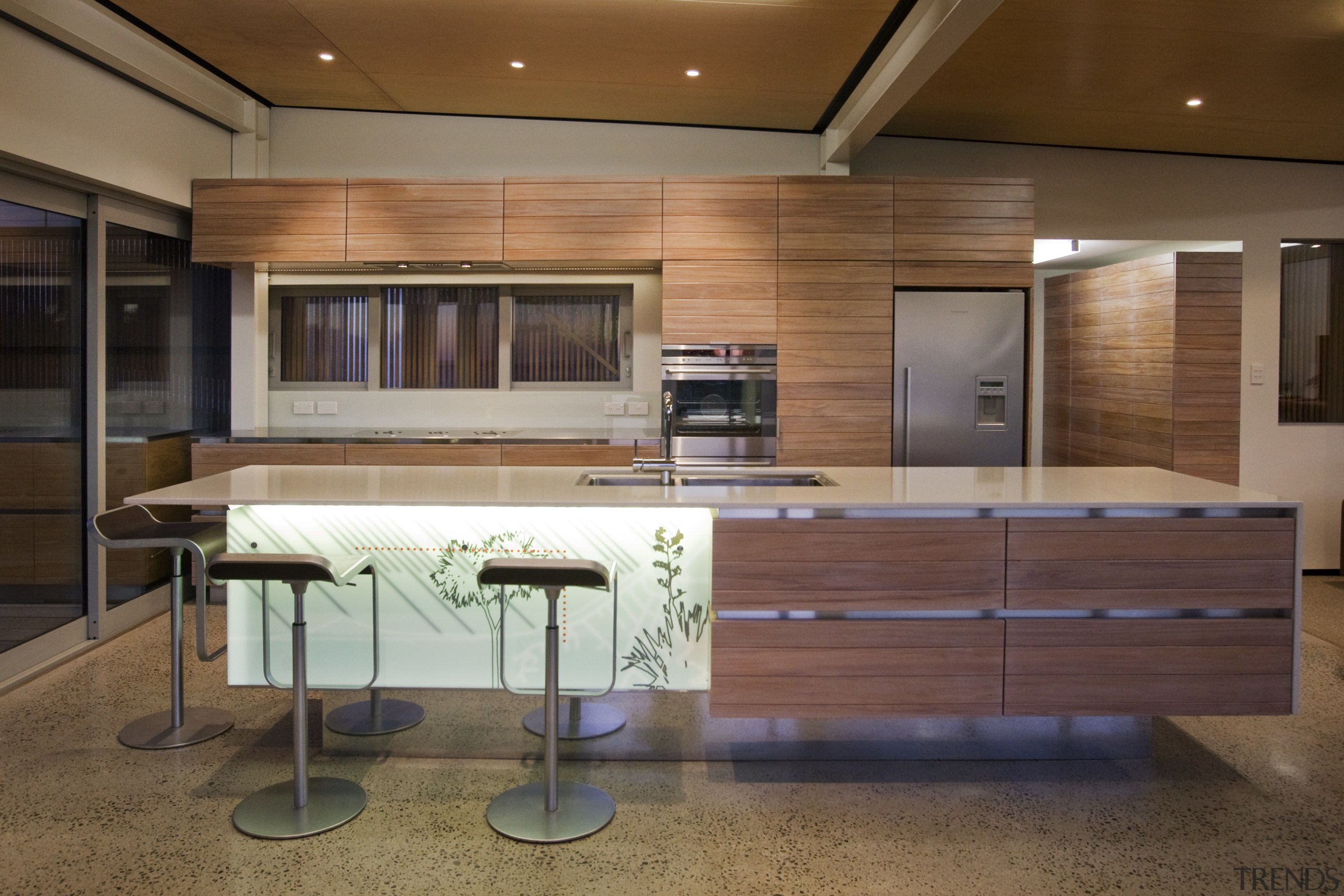 View of a kitchen which features an island cabinetry, ceiling, countertop, furniture, interior design, kitchen, wood, brown