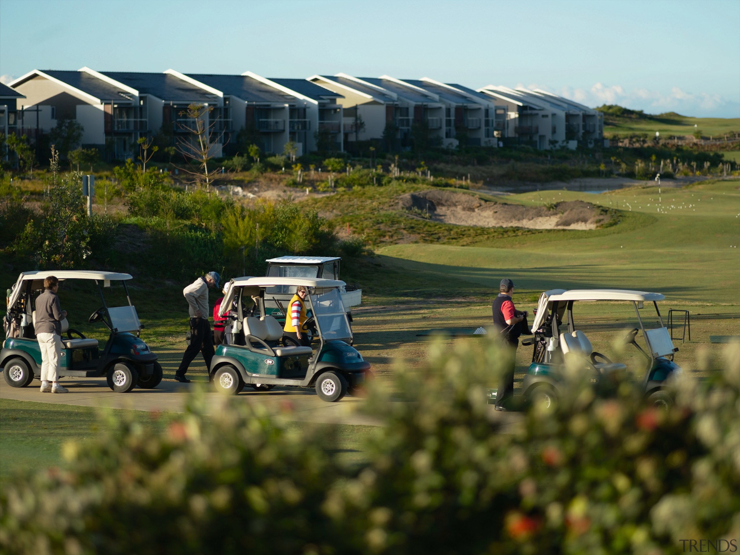 Ab exterior view of the Magenta shores holiday/residential car, golf club, golf course, grass, landscape, plant, recreation, tree, vehicle, brown