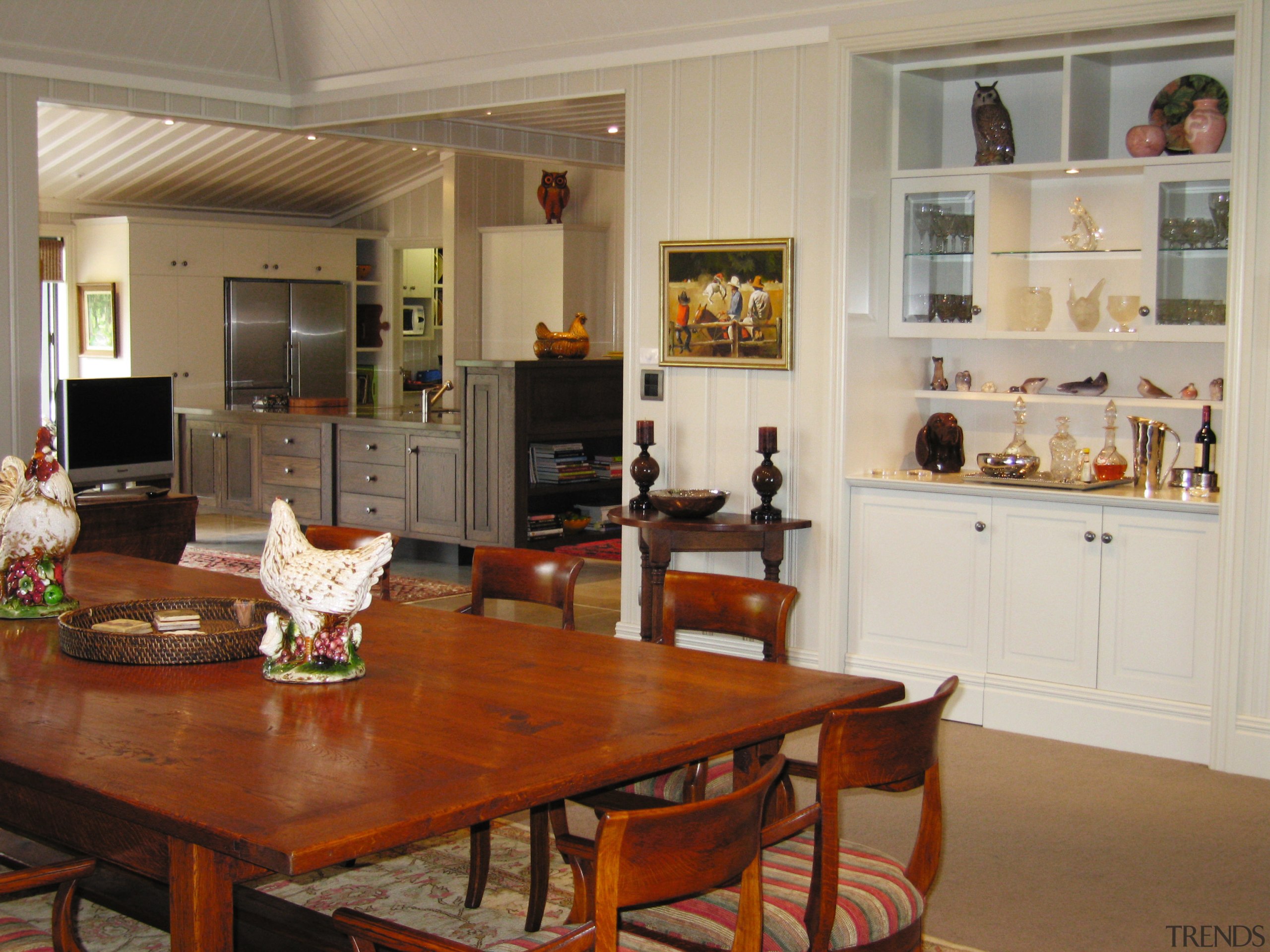 A view of a kitchen and some cabinetry chair, dining room, flooring, furniture, home, interior design, kitchen, living room, real estate, room, table, gray, brown