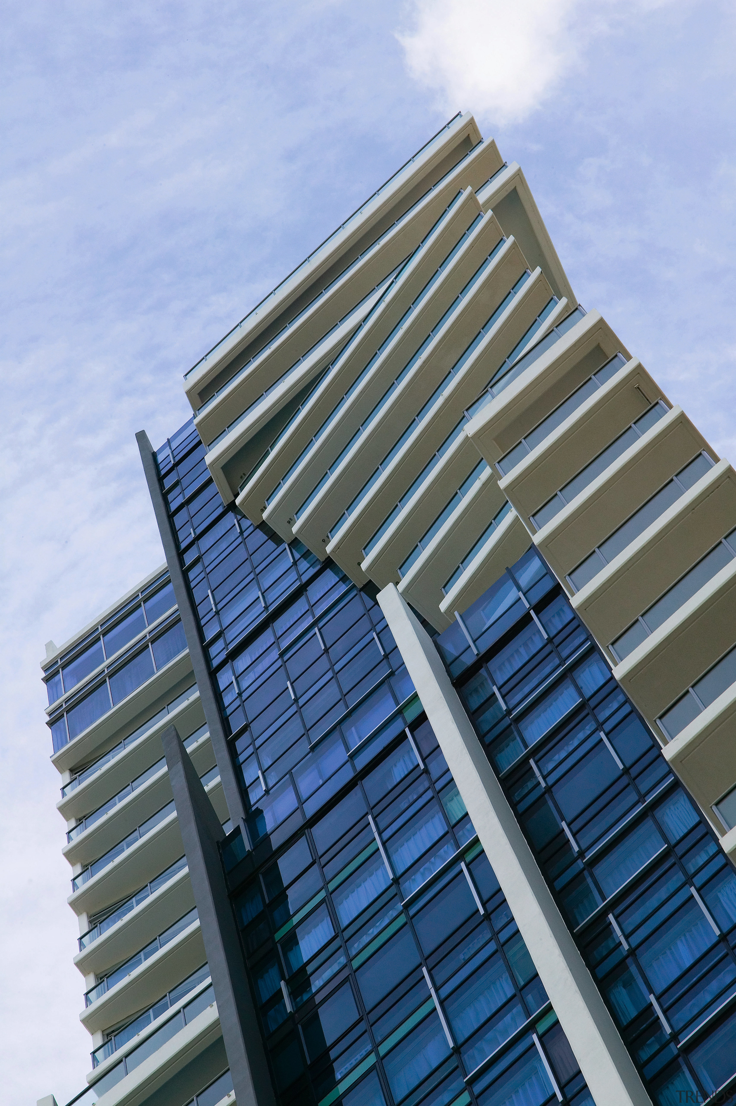 An exterior view of the Artique apartment complex architecture, building, commercial building, condominium, corporate headquarters, daylighting, daytime, facade, headquarters, landmark, line, metropolis, metropolitan area, residential area, sky, skyscraper, tower block, urban area, teal