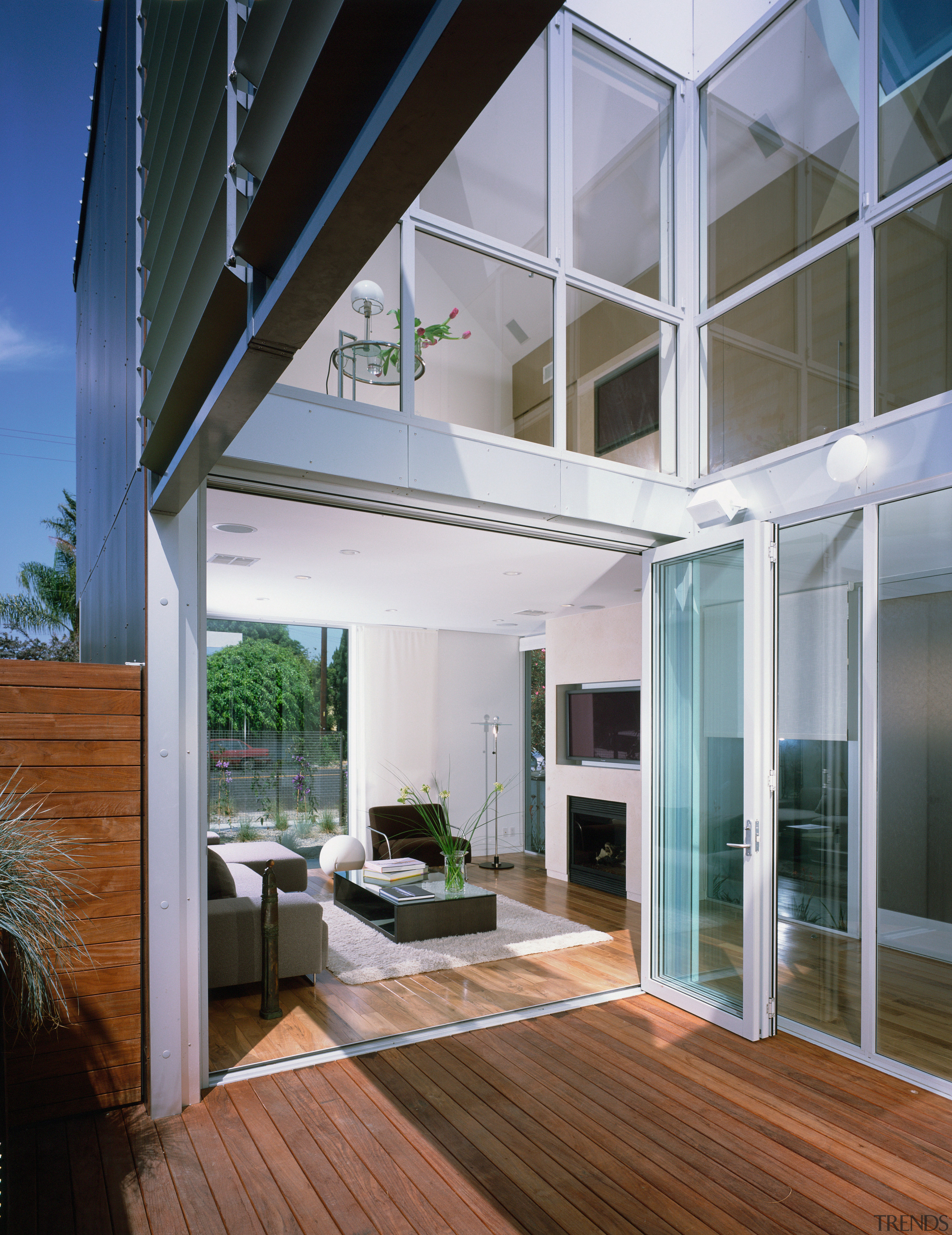An interior view of the living area featuring architecture, balcony, condominium, daylighting, home, house, interior design, real estate, window, gray