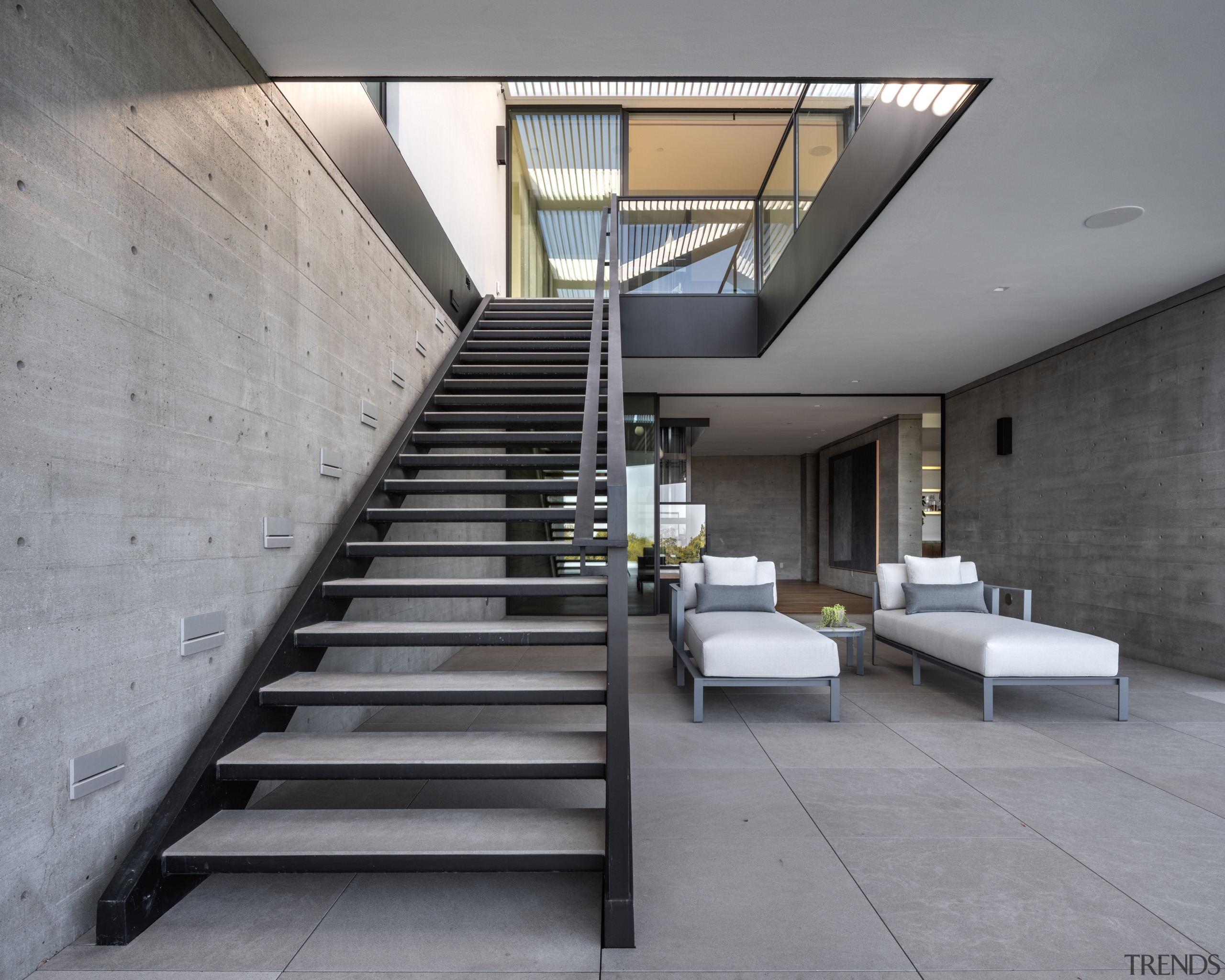 Metal stairs and concrete surfaces create a semi-industrial 