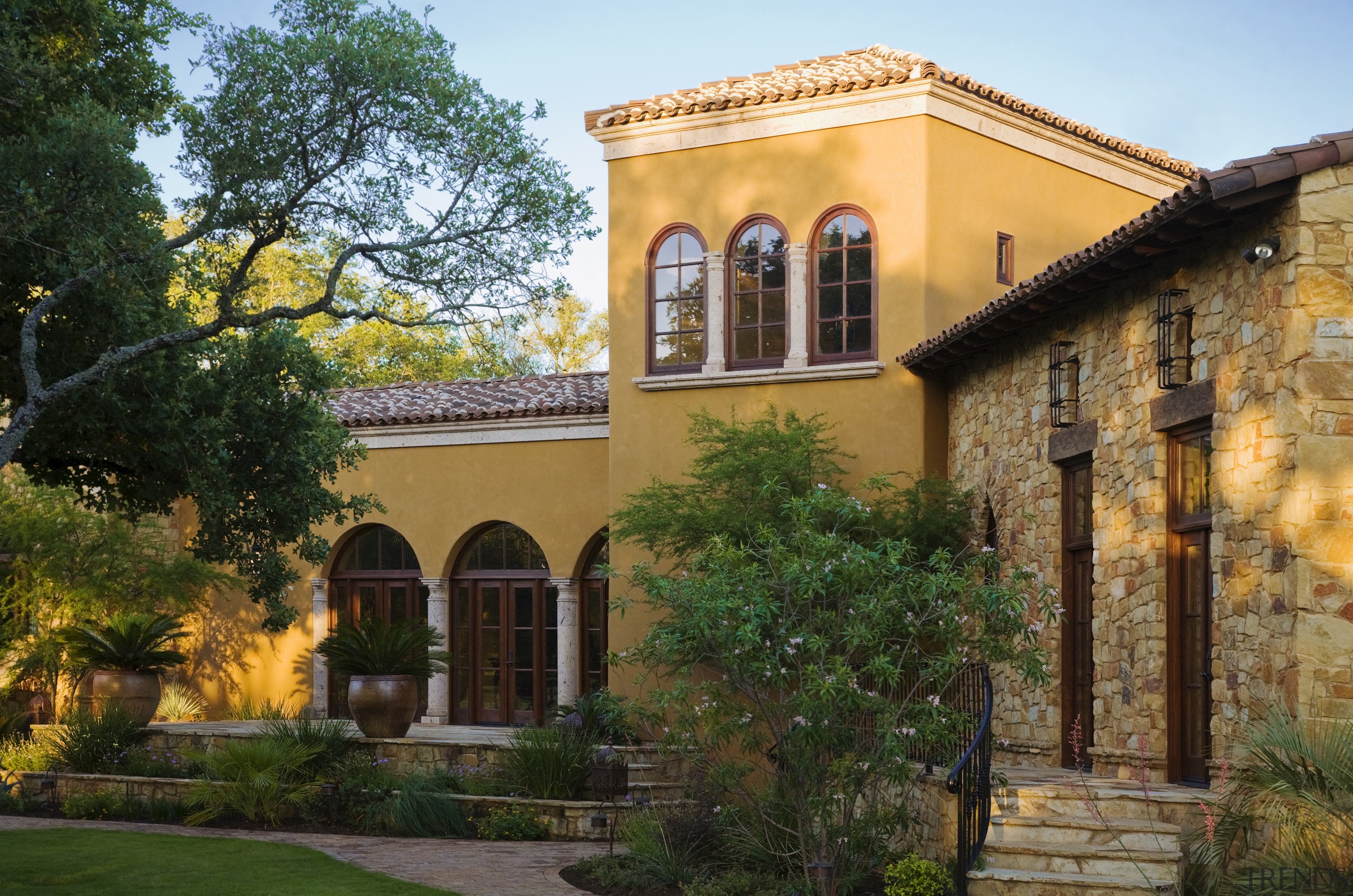 Image of the exterior of this new home. architecture, building, courtyard, estate, facade, hacienda, historic house, home, house, mansion, property, real estate, tree, villa, window, brown