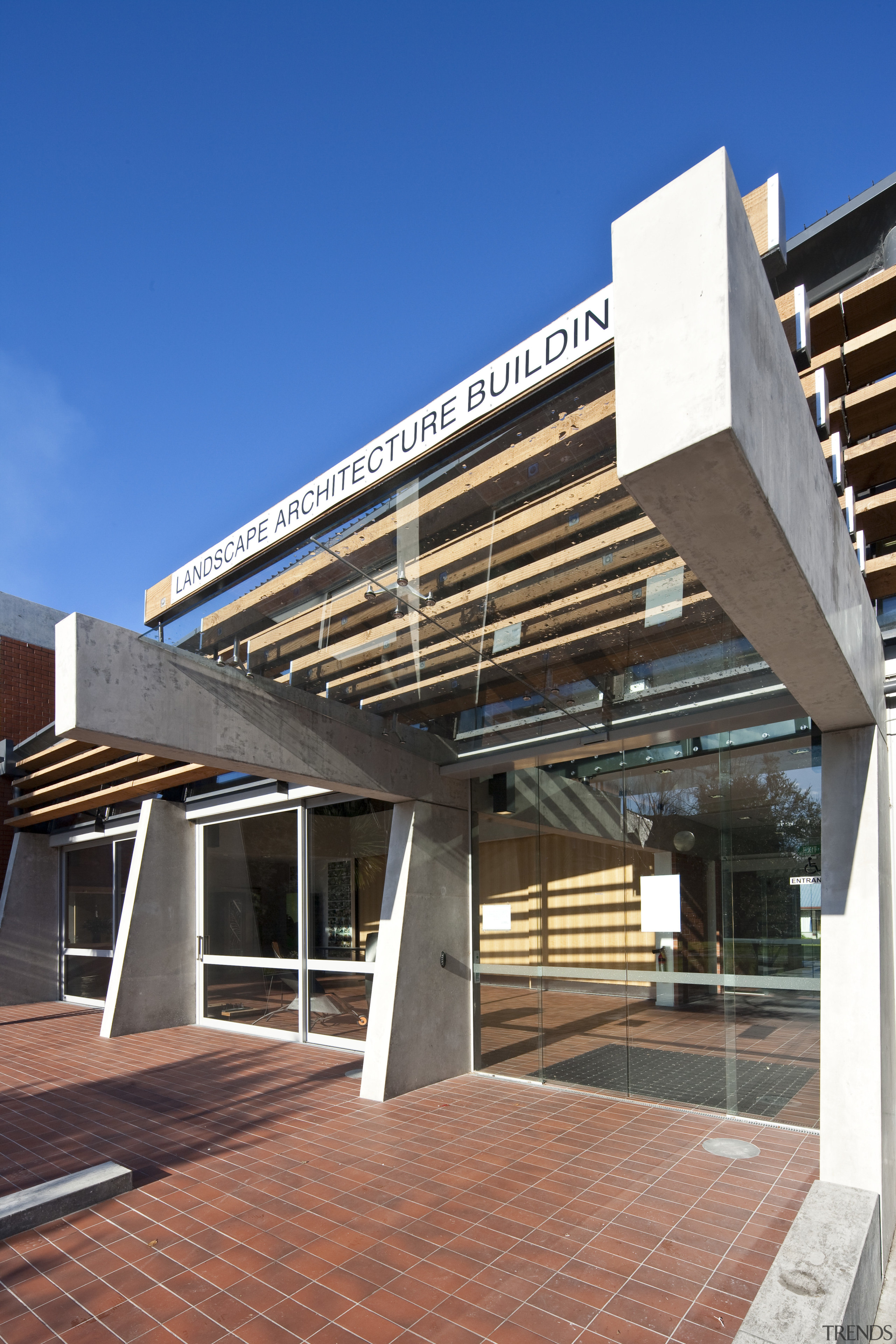 The entrance way of the university - The architecture, building, commercial building, condominium, corporate headquarters, daylighting, daytime, facade, mixed use, real estate, residential area, blue