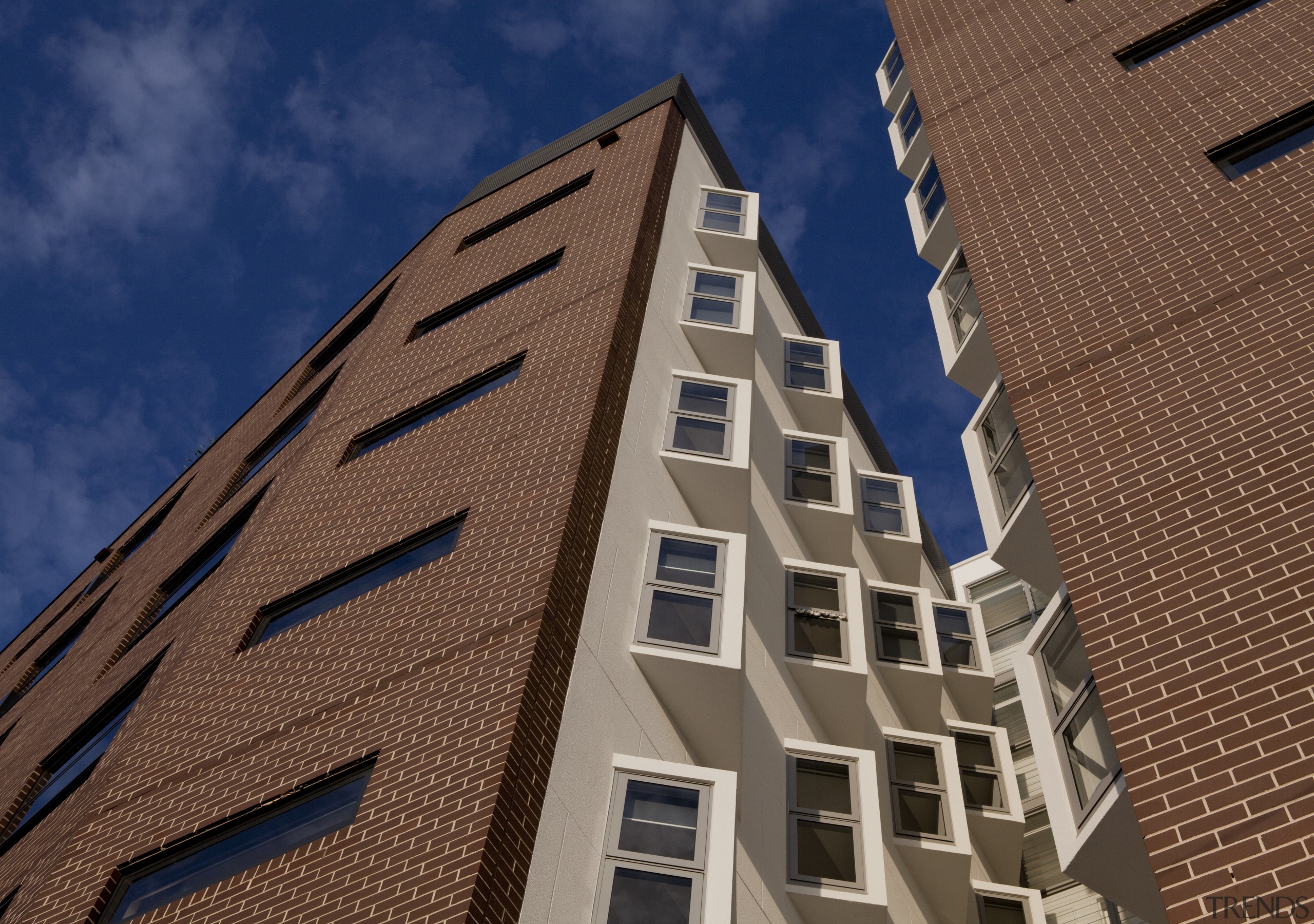 View of the Boston University student accommodation in angle, apartment, architecture, brick, building, commercial building, condominium, daytime, elevation, facade, home, house, metropolis, metropolitan area, neighbourhood, real estate, residential area, roof, sky, skyscraper, tower block, urban area, wall, window, brown