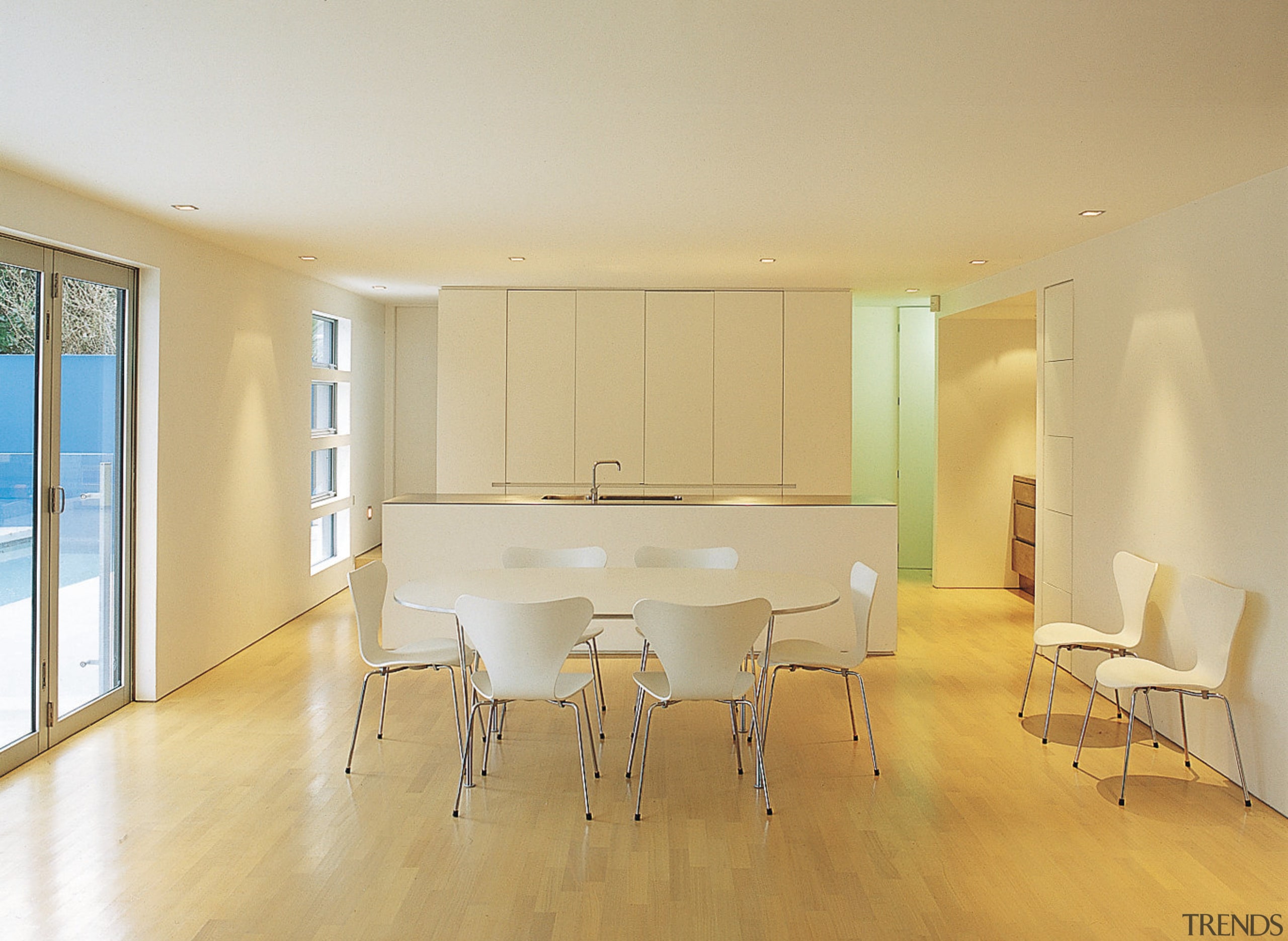 An interior view of the living areas featuring apartment, architecture, ceiling, chair, daylighting, dining room, floor, flooring, hardwood, home, house, interior design, laminate flooring, property, real estate, room, table, wall, window, wood, wood flooring, orange