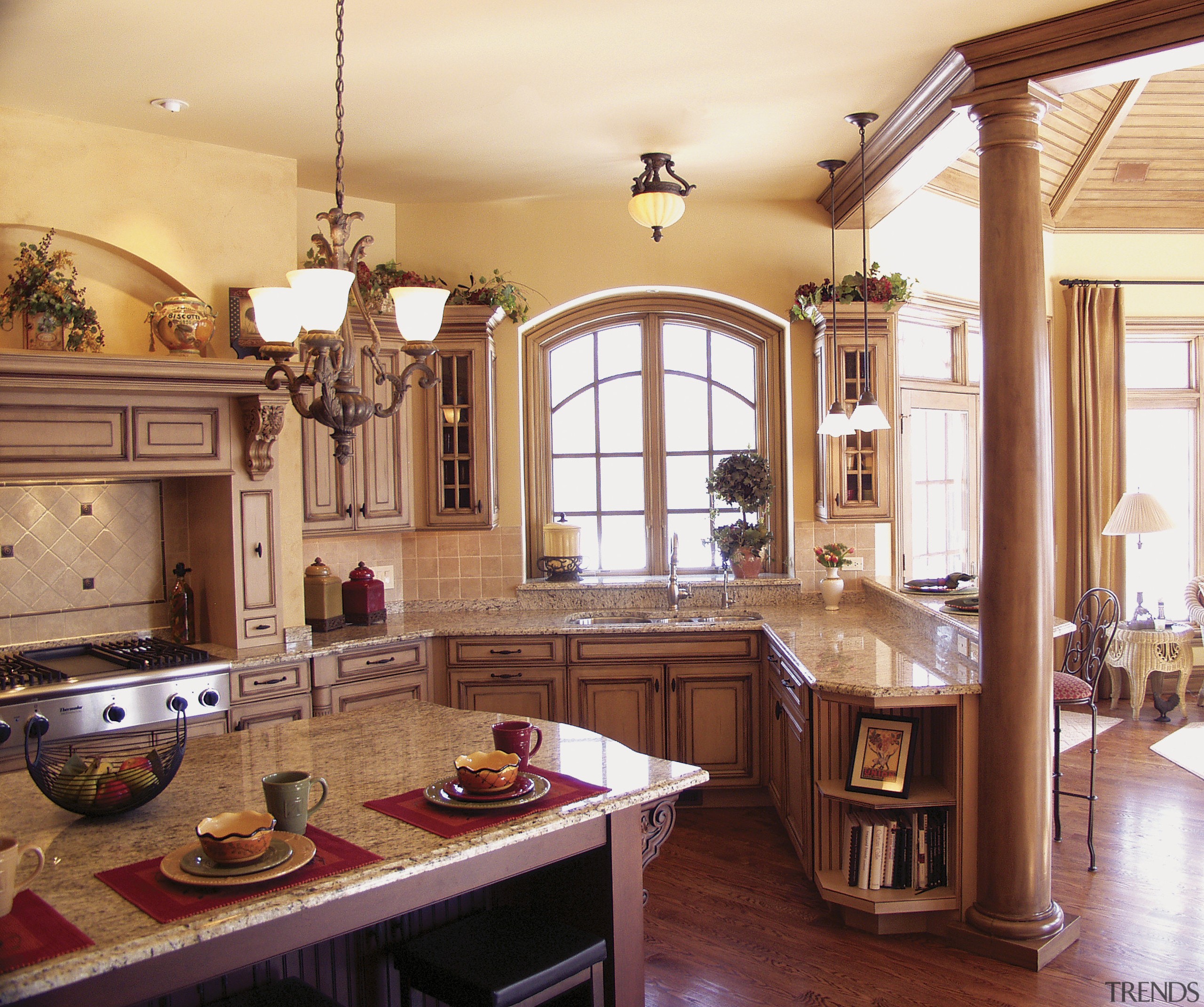 view of kitchen featuring cabinetry, wooden floors, lighting, cabinetry, ceiling, countertop, cuisine classique, estate, home, interior design, kitchen, real estate, room, window, orange