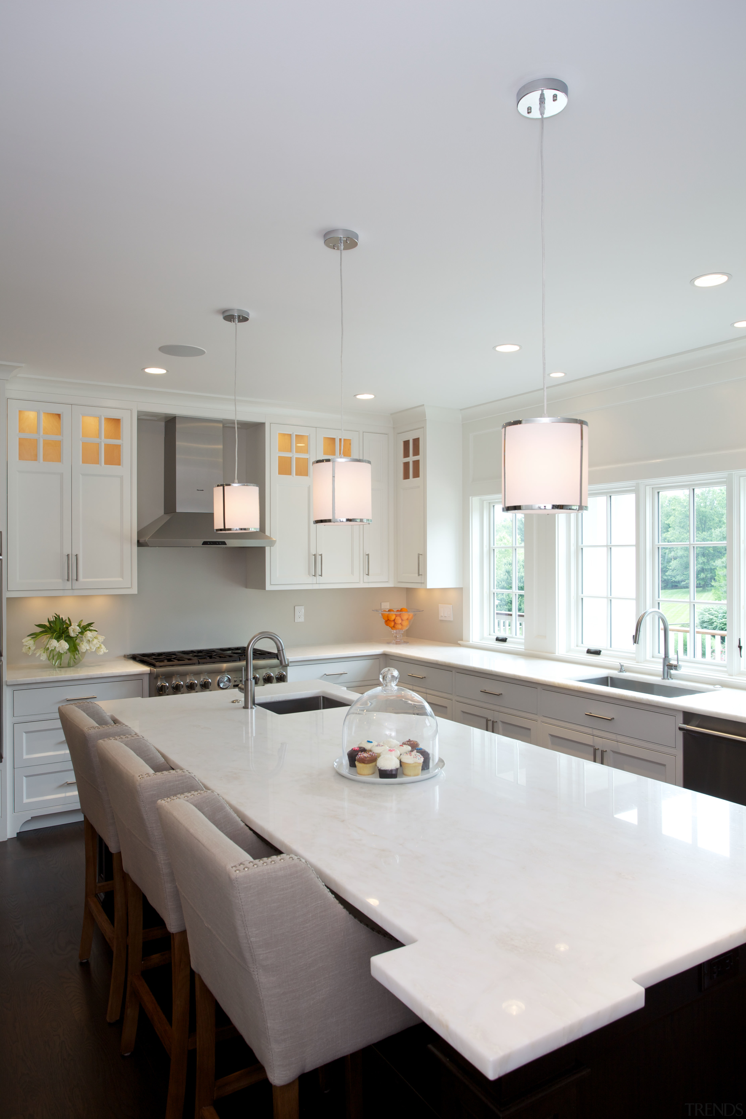 Corner detailing makes the island seem more of ceiling, countertop, daylighting, home, interior design, kitchen, light fixture, lighting, room, table, gray, white