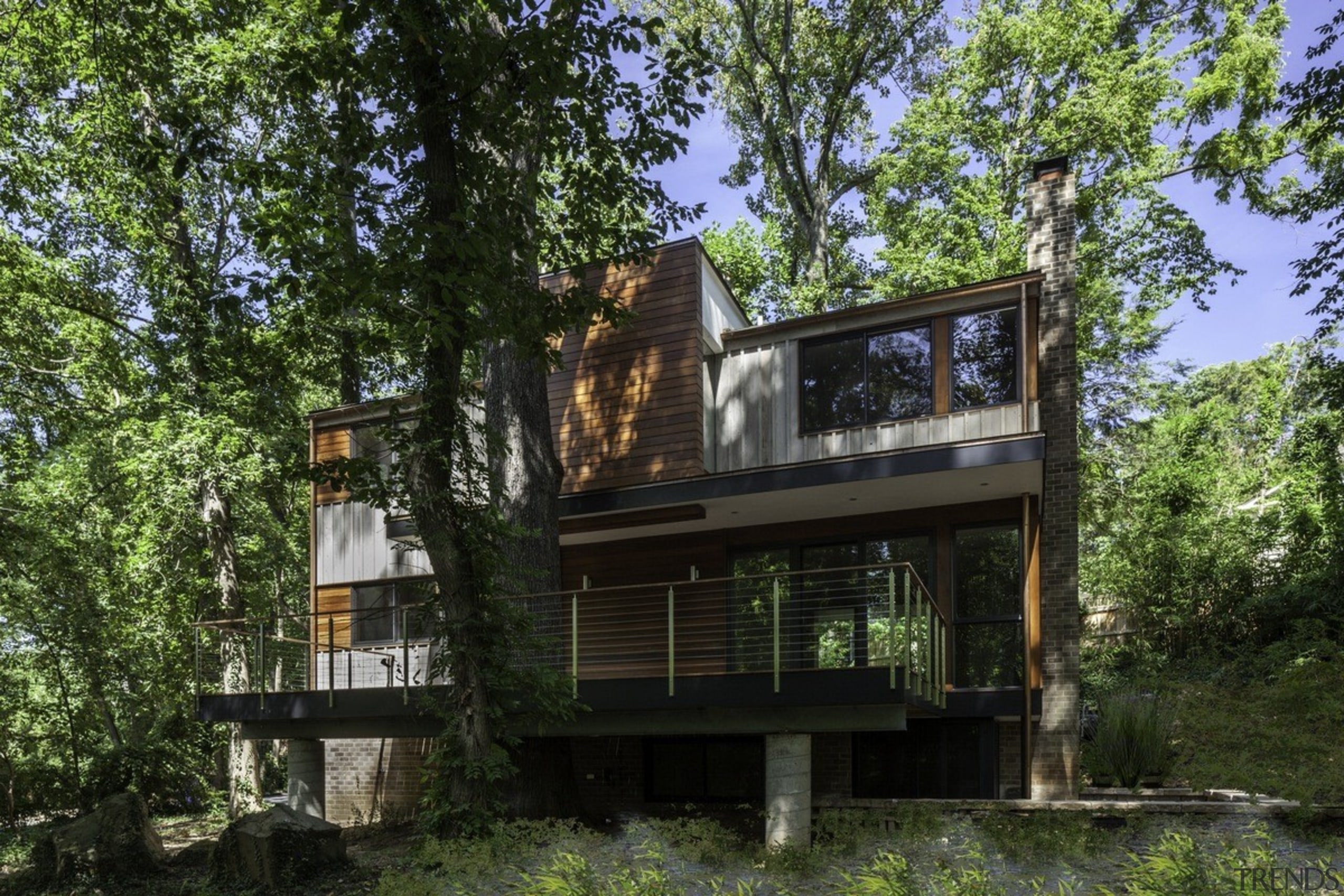 The home sited in an idyllic forest setting architecture, building, cottage, home, house, property, real estate, tree, brown, black