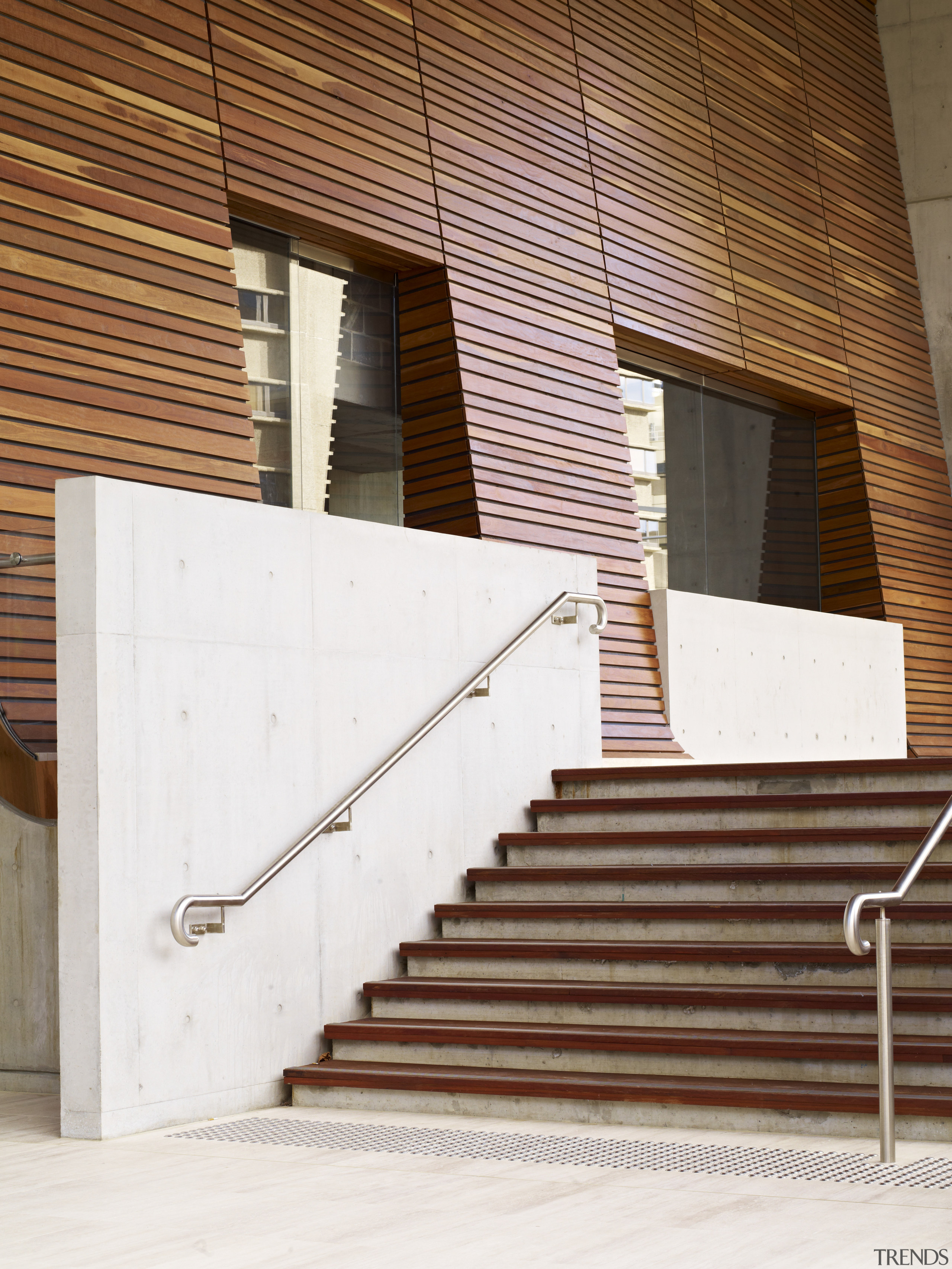 View of the entrance stairway with cladding by architecture, brick, brickwork, building, daylighting, door, facade, handrail, house, line, siding, stairs, wall, window, wood, wood stain, white, brown