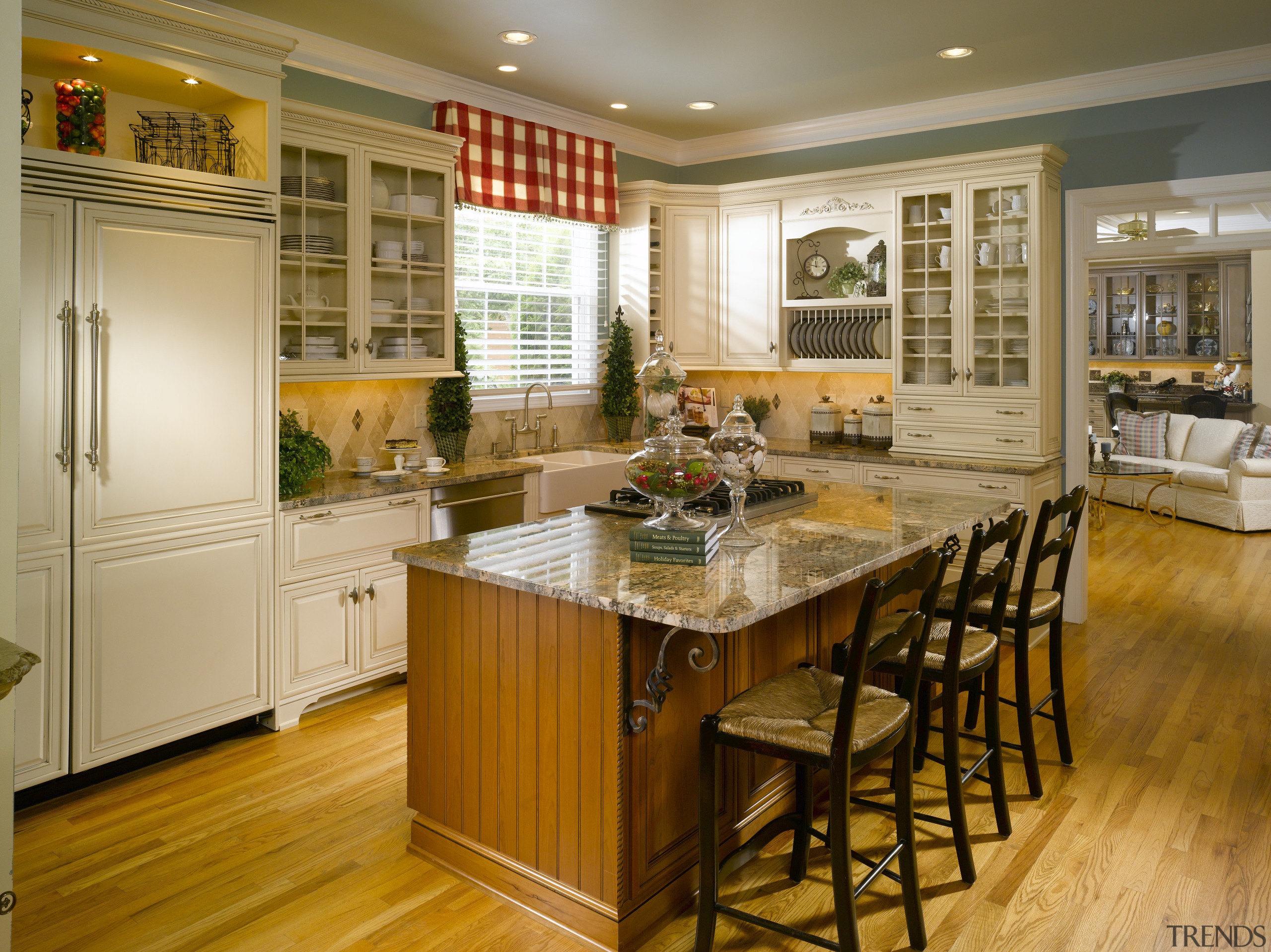 View of a kitchen with a traditional design cabinetry, countertop, cuisine classique, floor, flooring, hardwood, interior design, kitchen, laminate flooring, room, wood, wood flooring, brown, orange