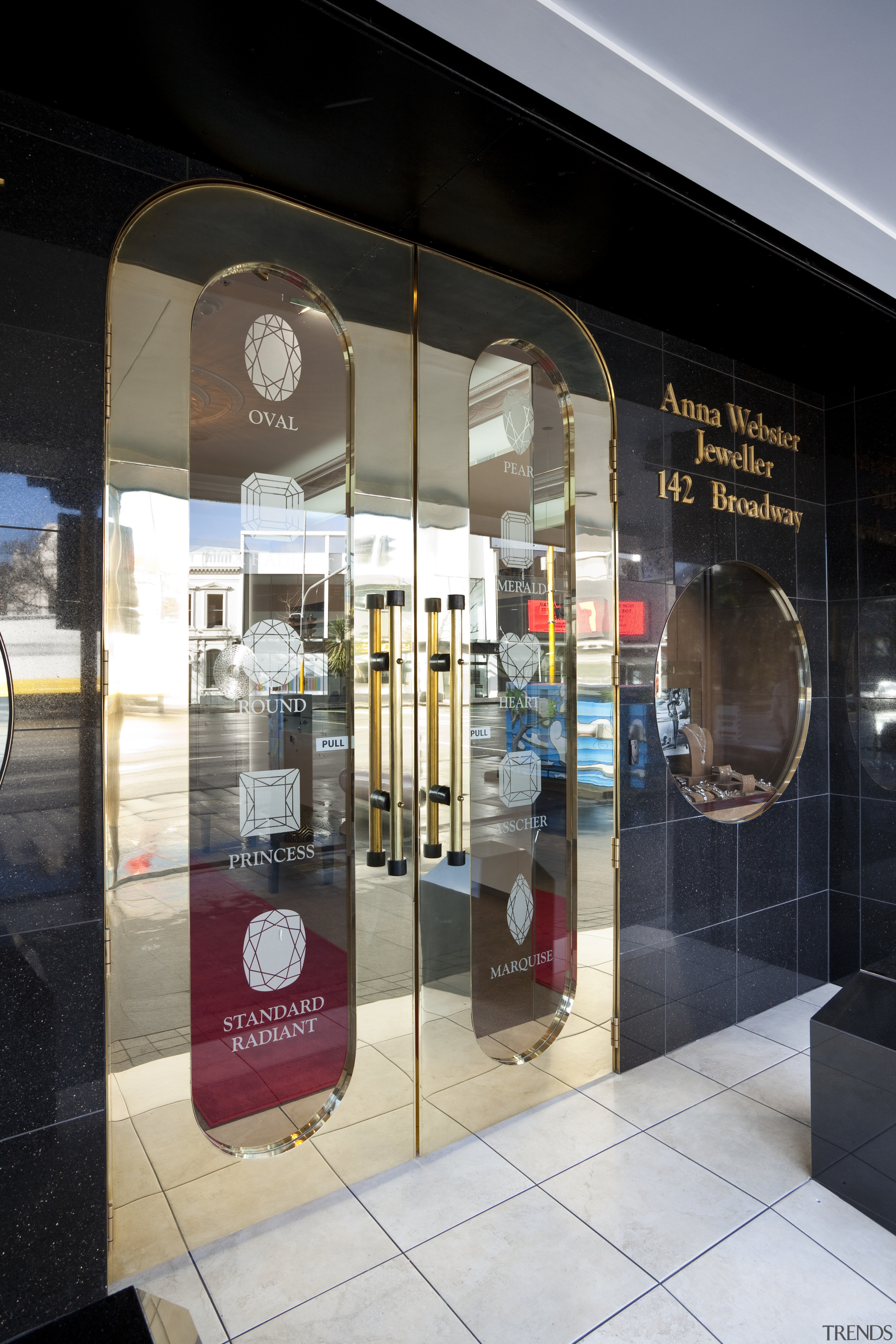 View of the Anna Webster Jeweler boutique.Features repeating display window, glass, interior design, retail, window, black, gray