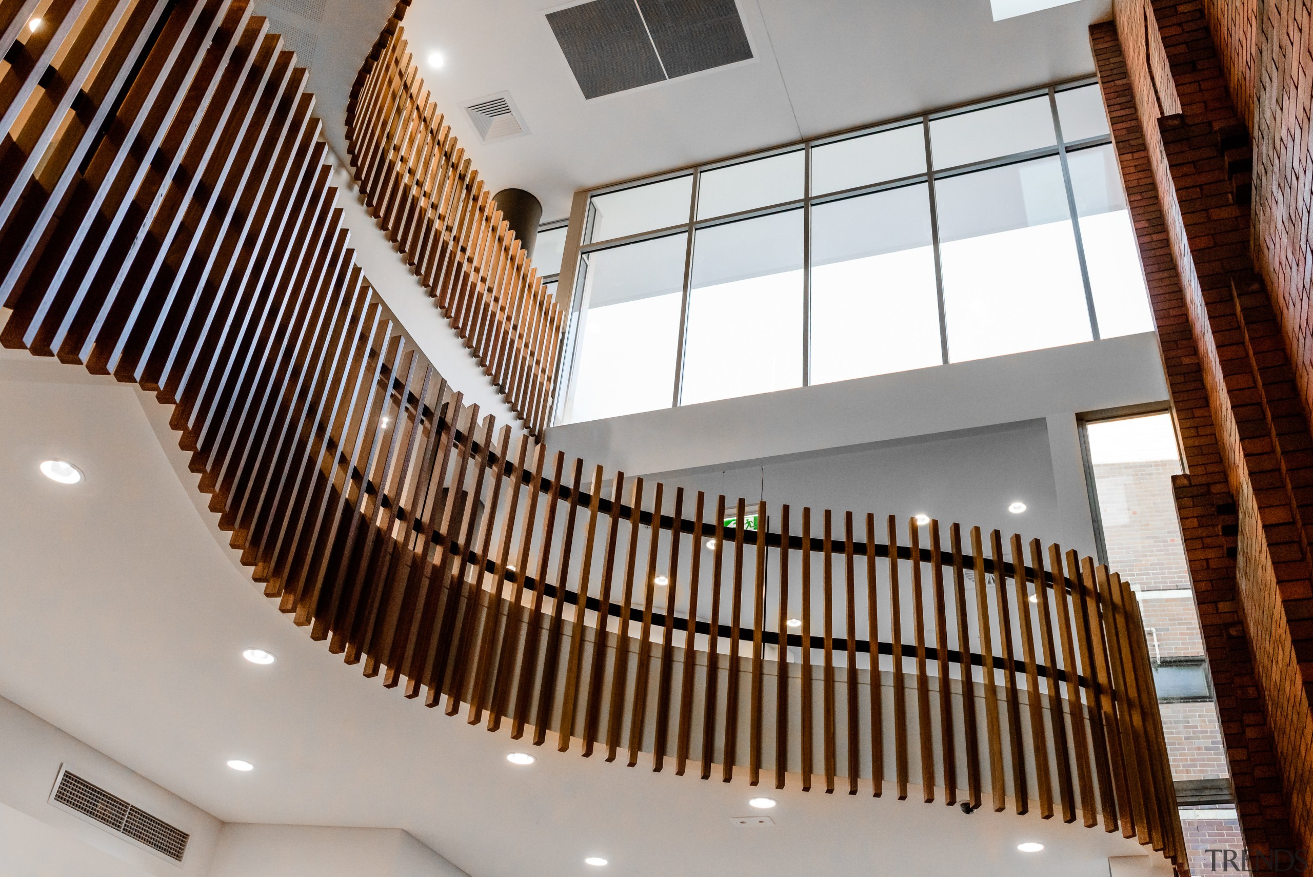 The atrium entrance to Rockdales public library has ceiling, interior design, stairs, gray