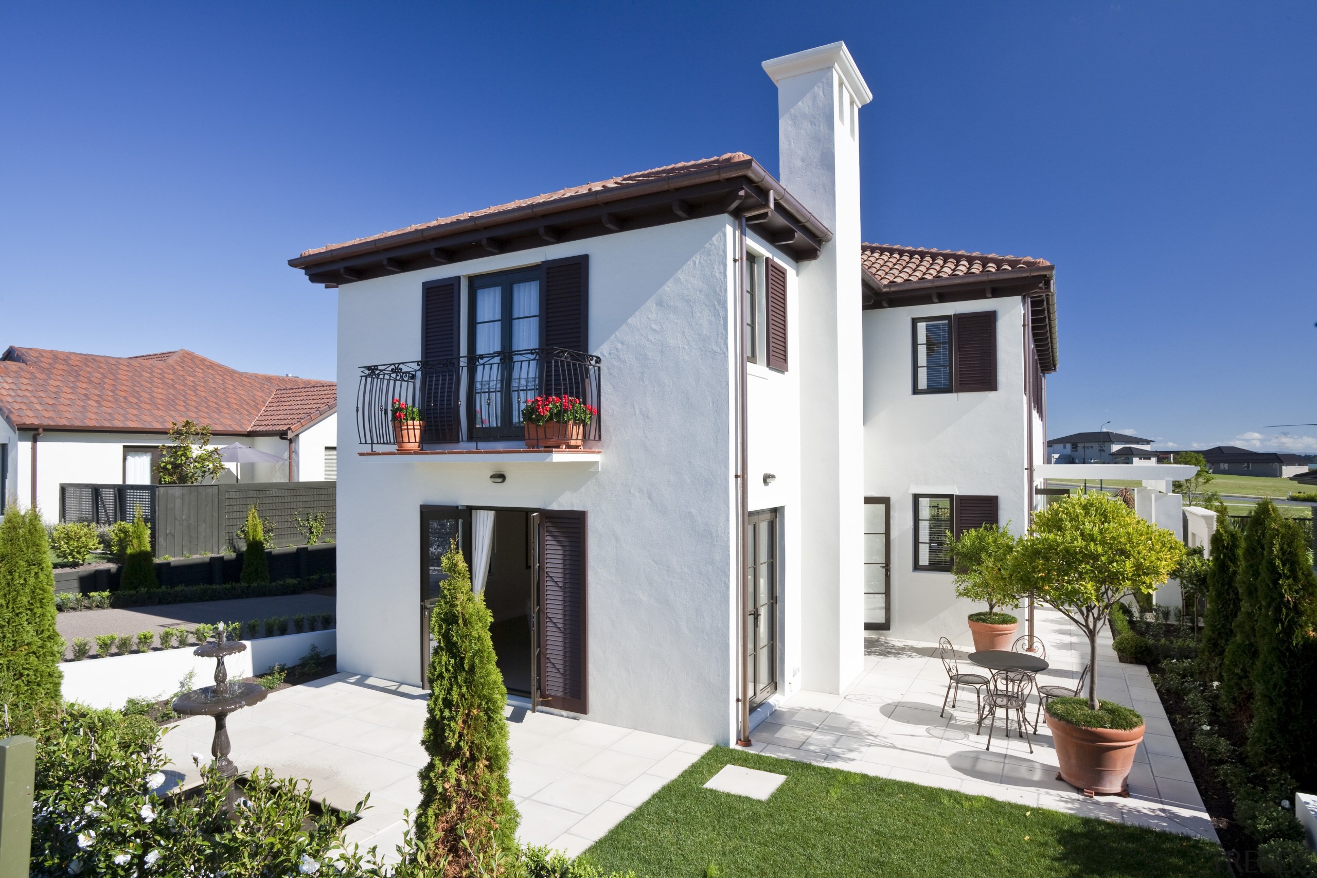 Exterior view of Eden Homes show home which building, cottage, elevation, estate, facade, home, house, property, real estate, residential area, villa, window