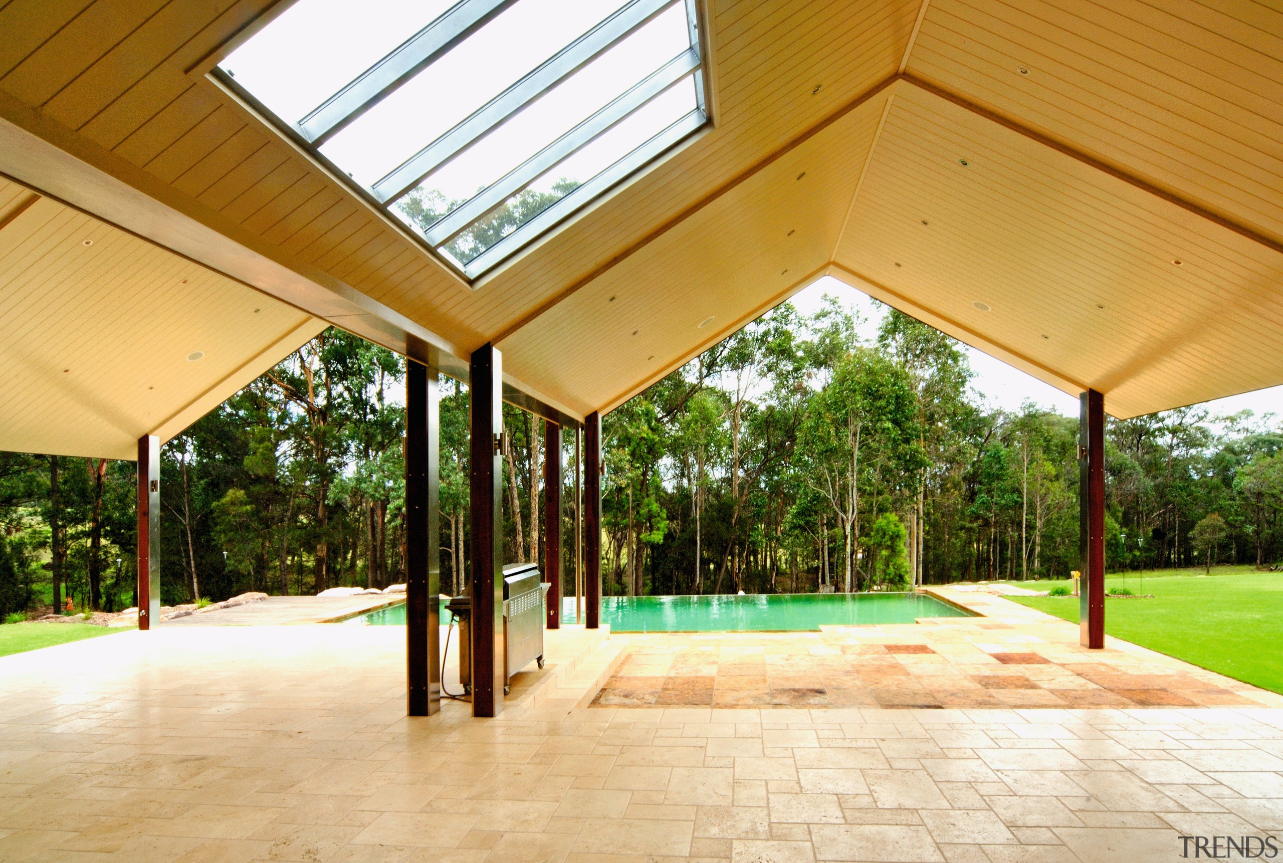 A view of some stone pavers treated with architecture, daylighting, estate, home, house, outdoor structure, property, real estate, roof, window, wood, orange, brown