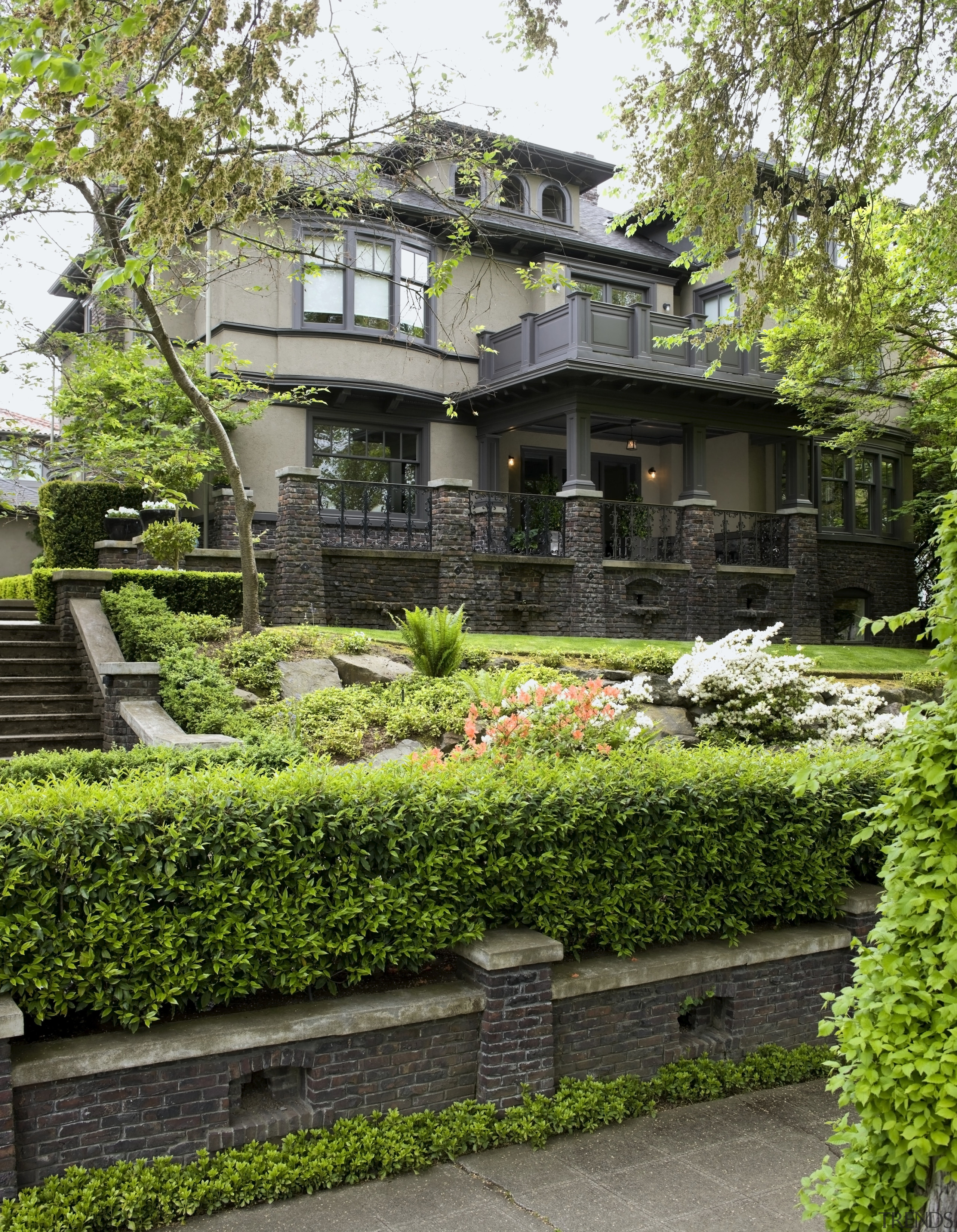 Exterior view of century old house featuring landscaping, architecture, estate, garden, grass, home, house, landscaping, mansion, outdoor structure, plant, tree, green