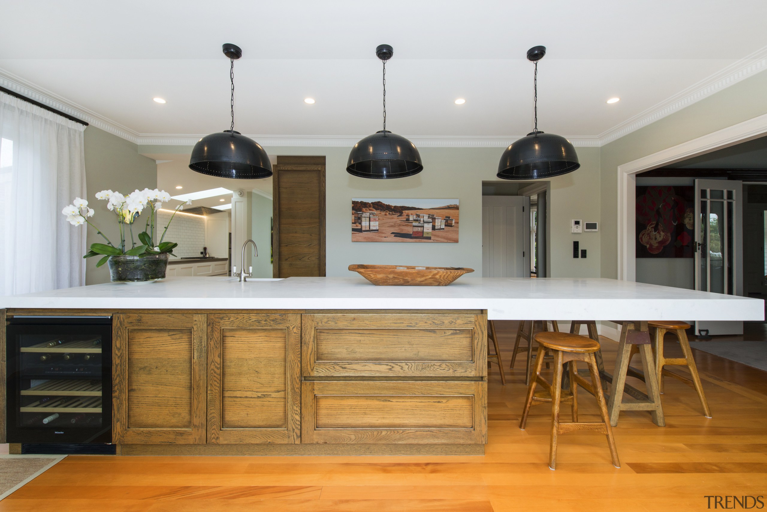 Crafted meets contemporary with this entertainers kitchen island, cabinetry, countertop, cuisine classique, furniture, hardwood, interior design, kitchen, room, table, gray