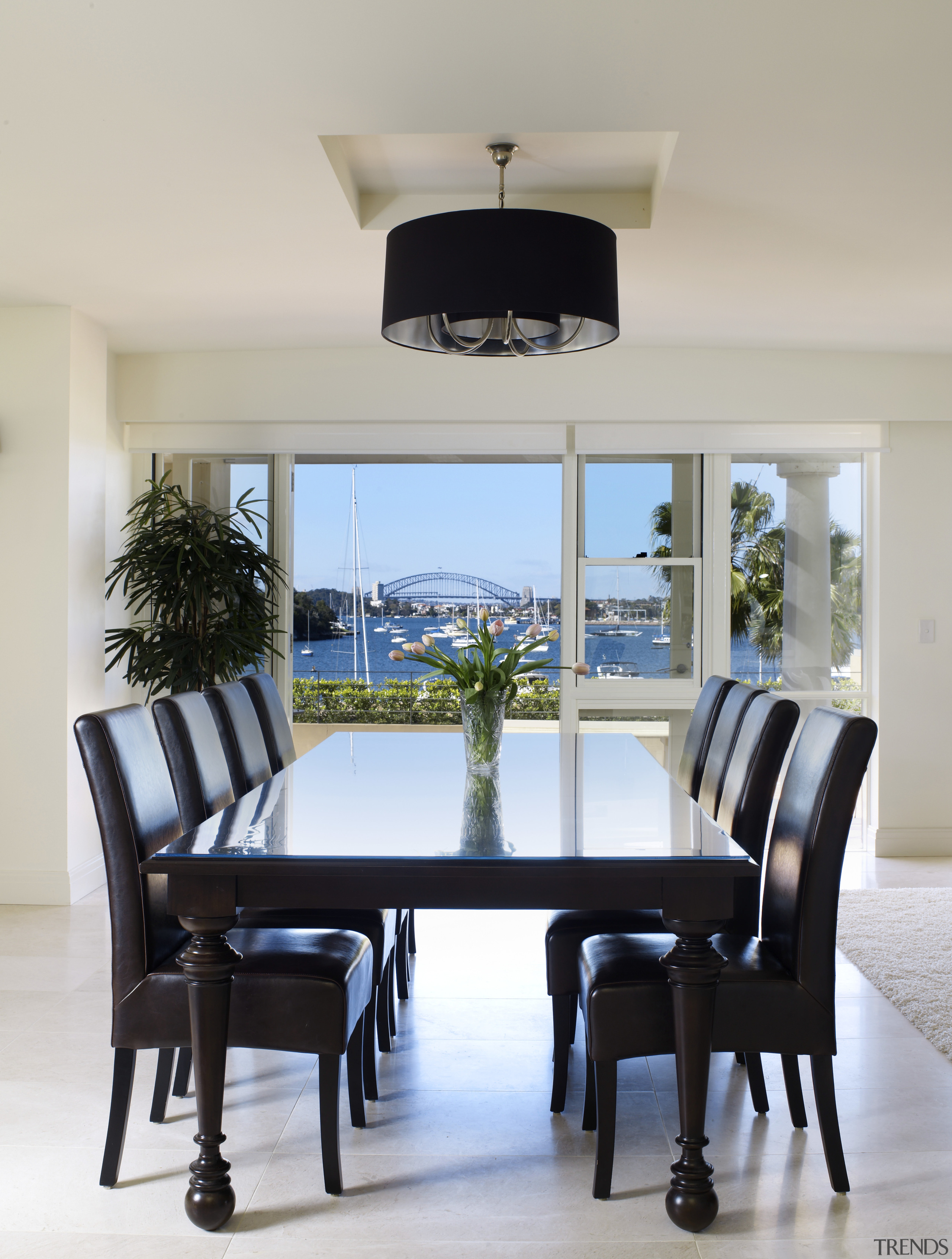 View of the dining area which features large chair, dining room, furniture, home, interior design, room, table, gray