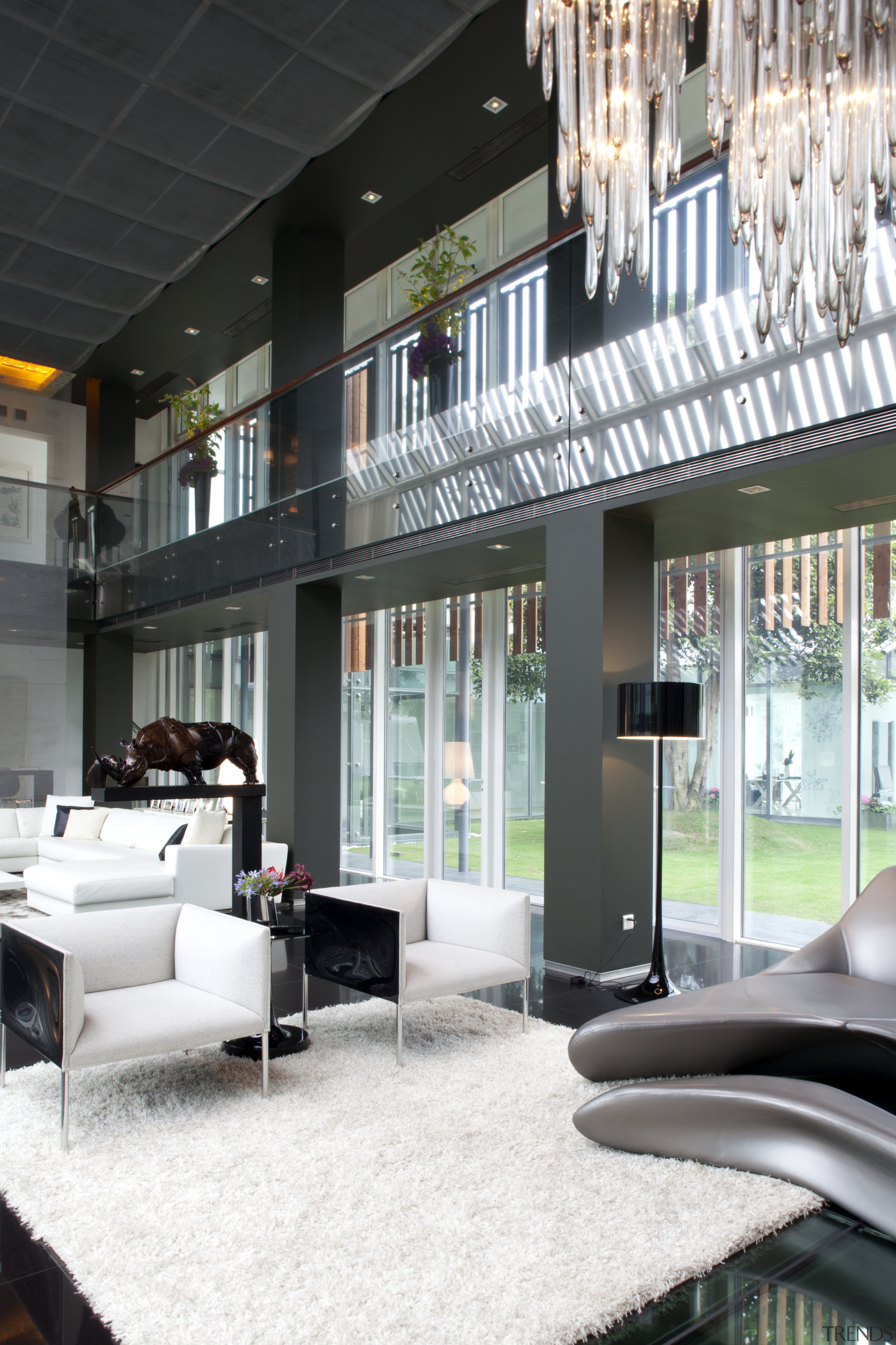 View of living area featuring white sofas, tiled architecture, ceiling, home, house, interior design, living room, lobby, window, white, black