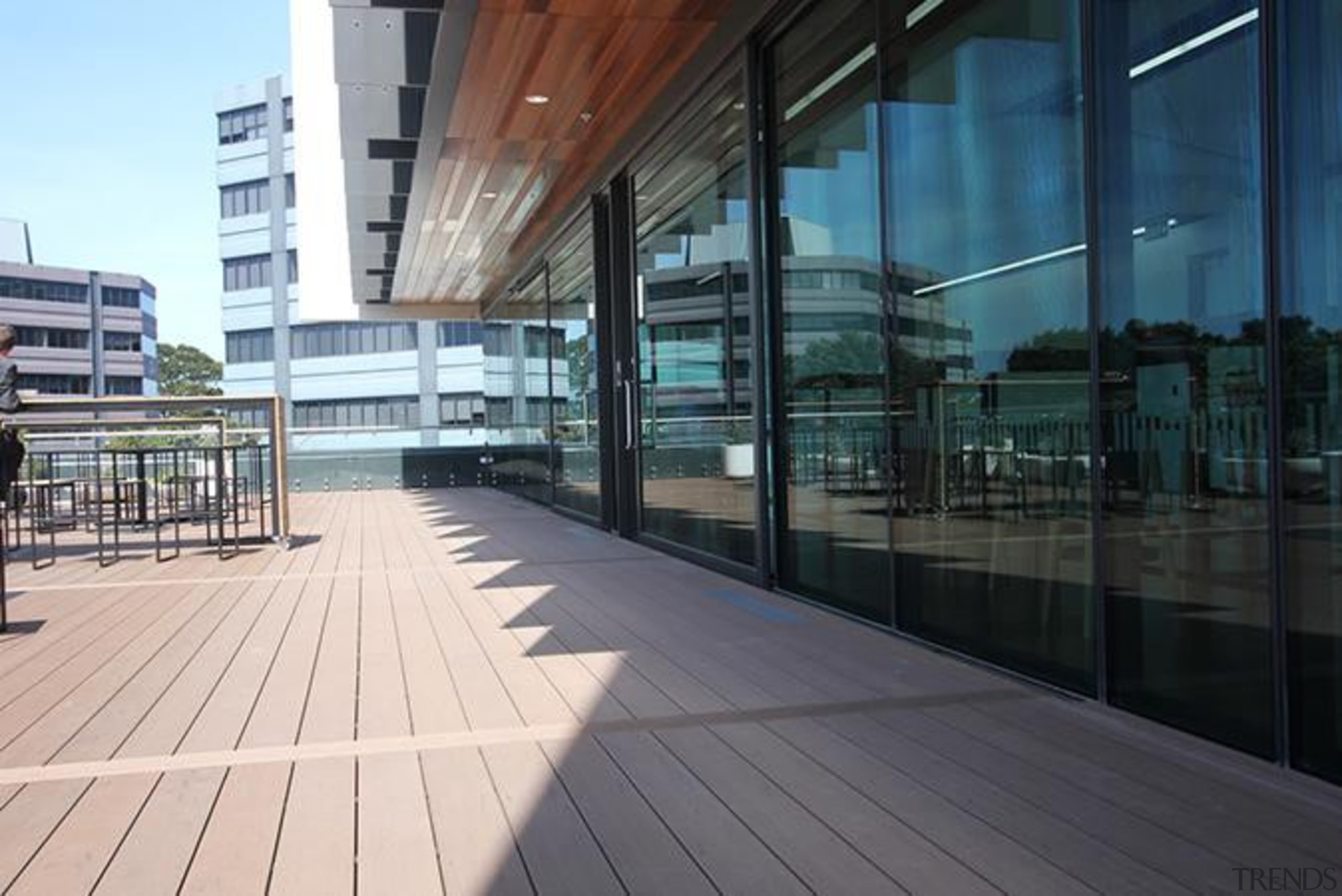 This large beautiful staff decking facility was build apartment, architecture, building, condominium, corporate headquarters, daylighting, facade, glass, metropolitan area, mixed use, reflection, structure, walkway, window, black, white