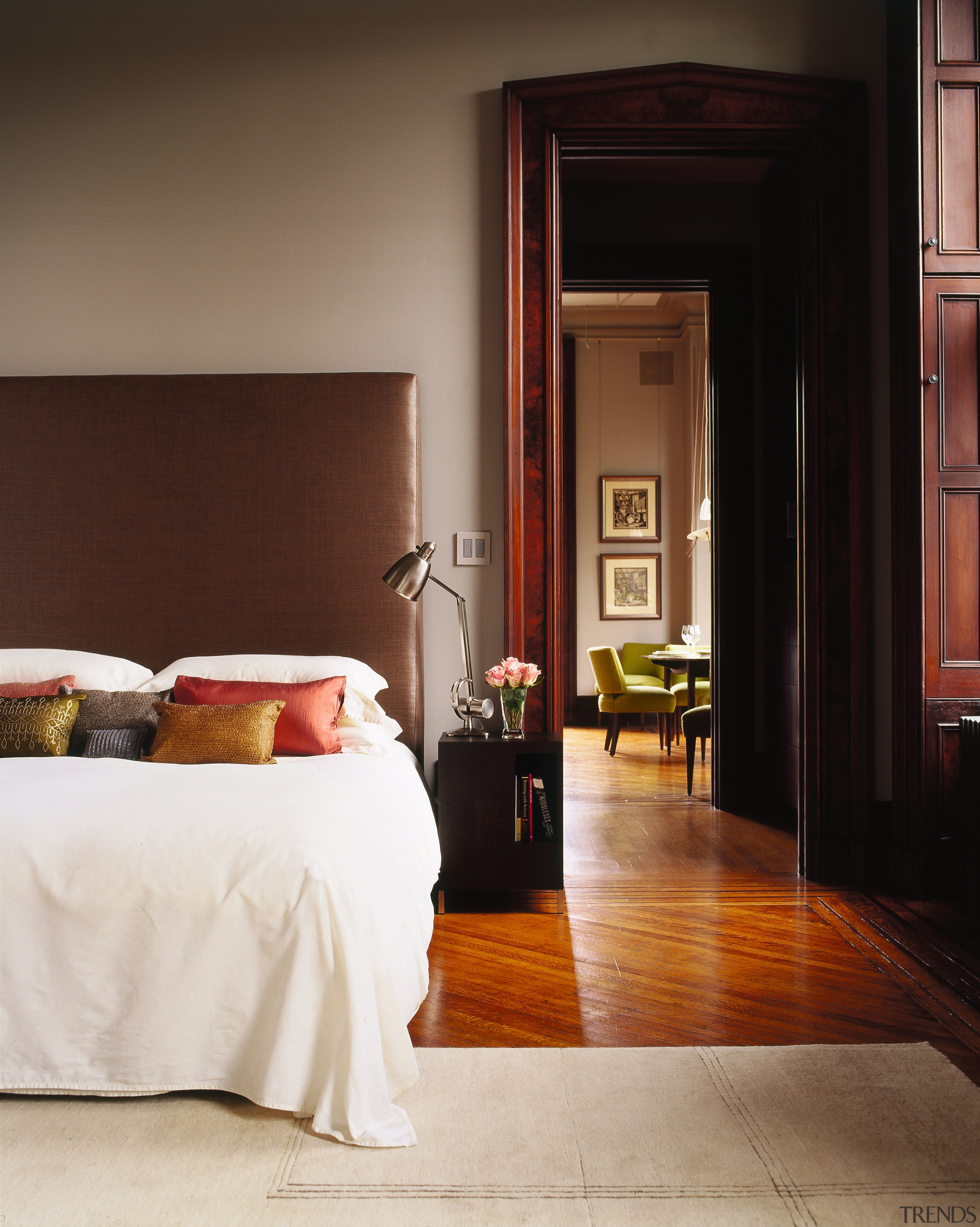 A view of the dining room and master bed, bed frame, bedroom, door, floor, flooring, furniture, hardwood, home, interior design, room, suite, window, wood, black, brown