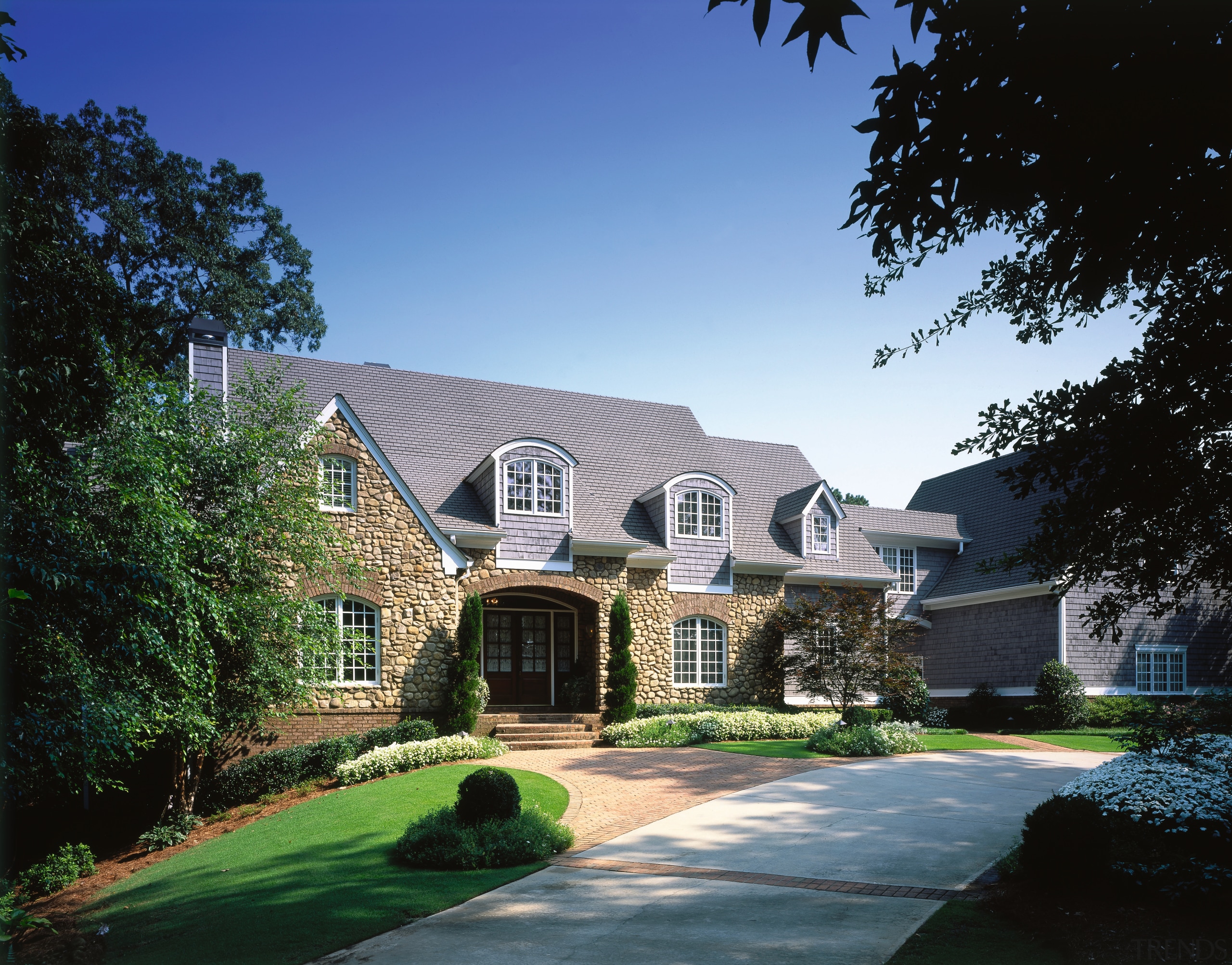 An exterior view of the house. - An cottage, elevation, estate, facade, farmhouse, historic house, home, house, landscape, landscaping, lawn, lighting, mansion, property, real estate, residential area, roof, siding, sky, suburb, window, yard, black