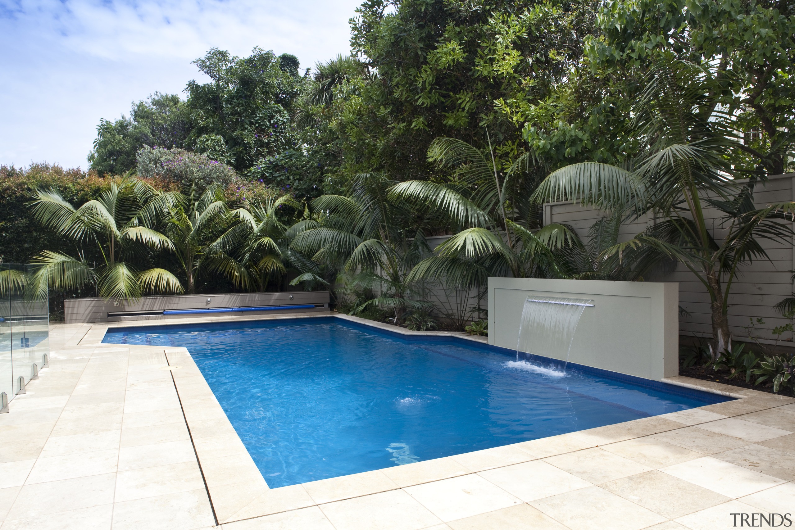 View of outdoor area with pool, paving, fountain, arecales, backyard, estate, house, leisure, palm tree, property, real estate, resort, swimming pool, villa, water, white