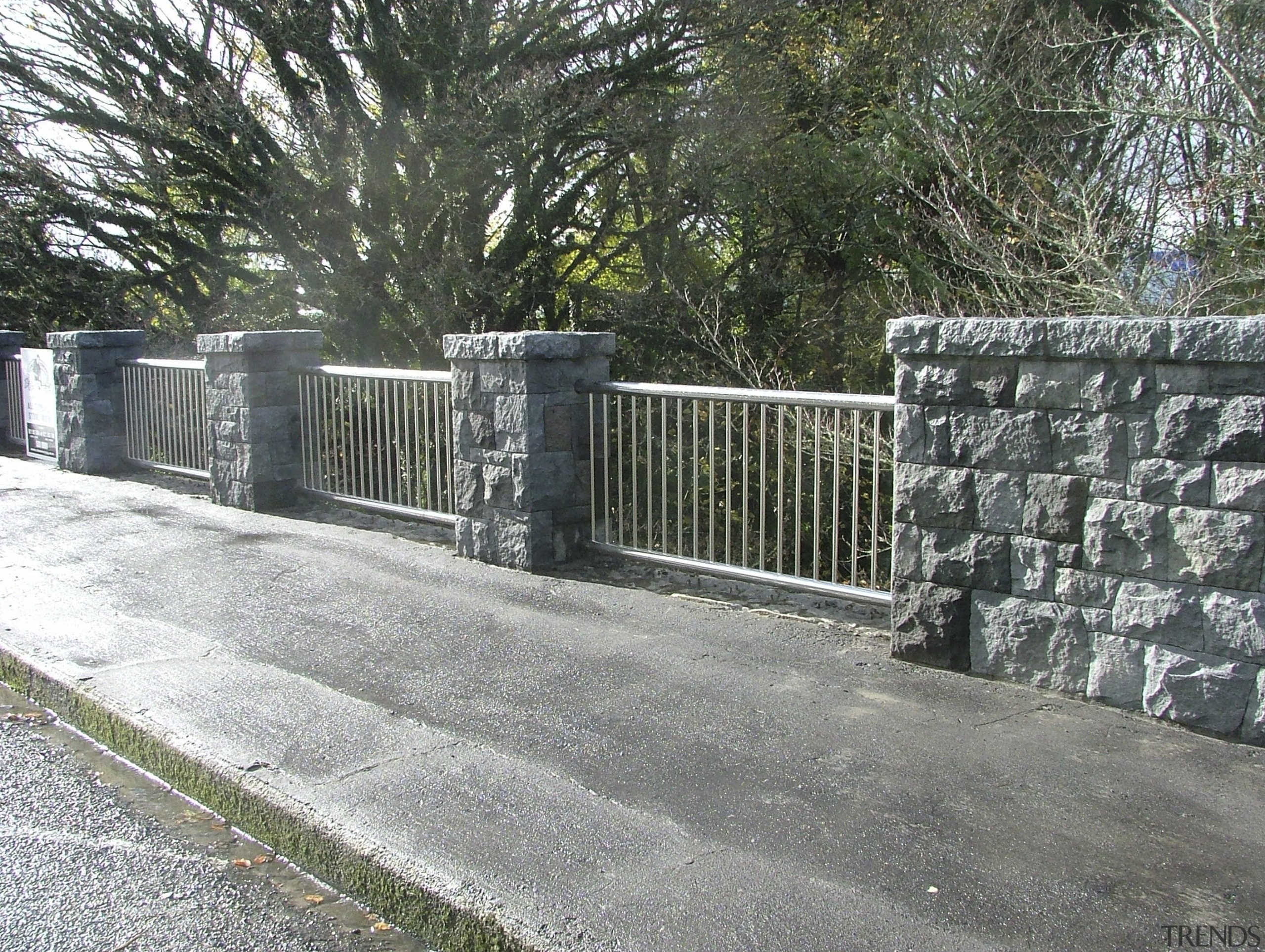 View of the stone balustrade of the Victoria fence, guard rail, home fencing, iron, outdoor structure, stone wall, walkway, wall, gray