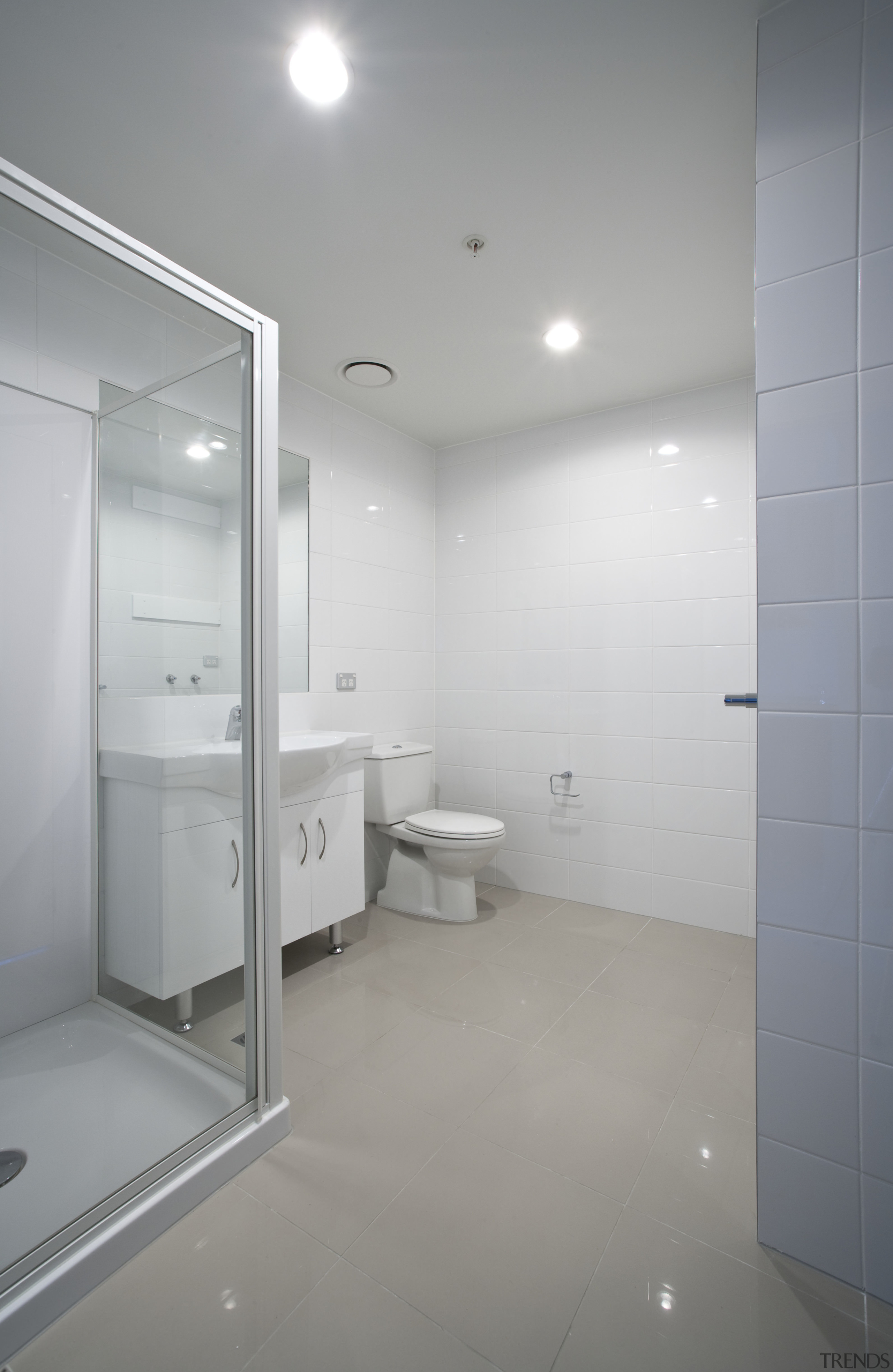 internal bathroom view of kings square/queens lodge development. architecture, bathroom, ceiling, daylighting, floor, glass, home, house, interior design, plumbing fixture, property, real estate, room, sink, tile, wall, gray