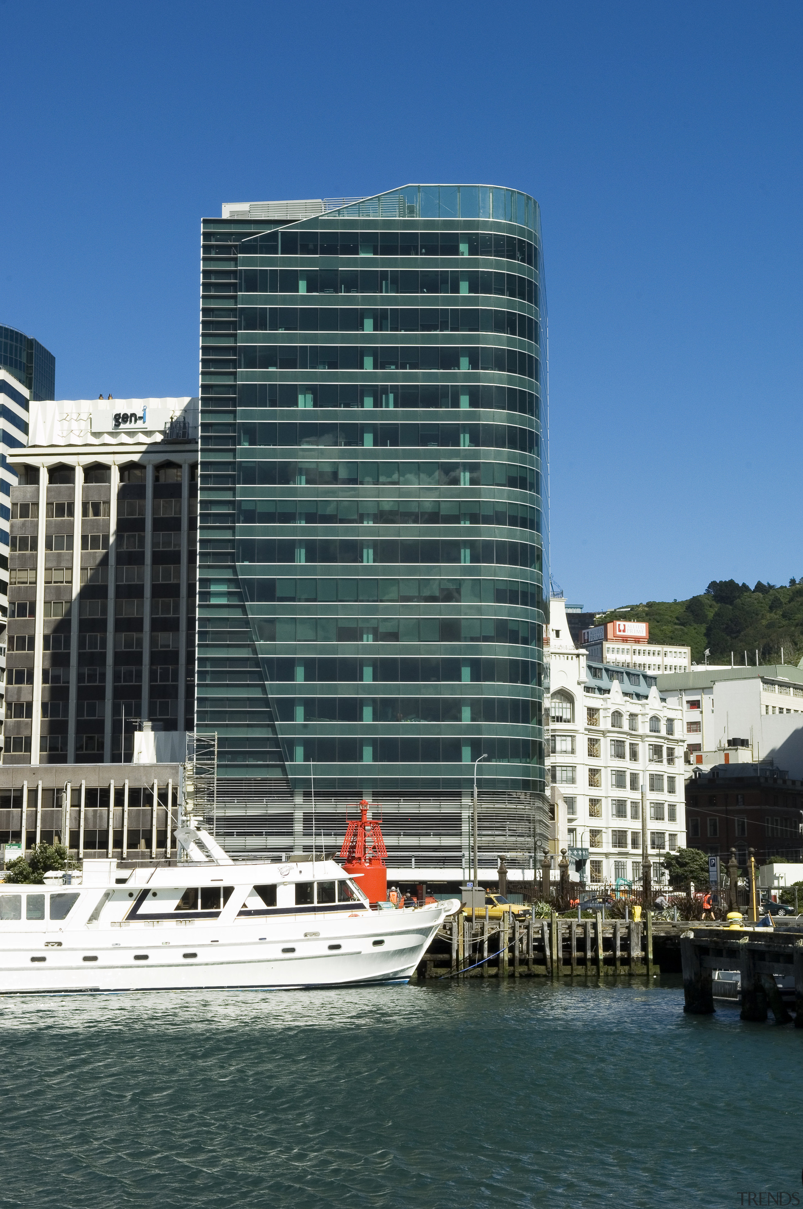 A view of an imaginative take on a architecture, boat, building, city, cityscape, commercial building, condominium, corporate headquarters, daytime, facade, harbor, headquarters, hotel, marina, metropolis, metropolitan area, mixed use, real estate, reflection, sky, skyline, skyscraper, tower block, urban area, water, water transportation, waterway, teal