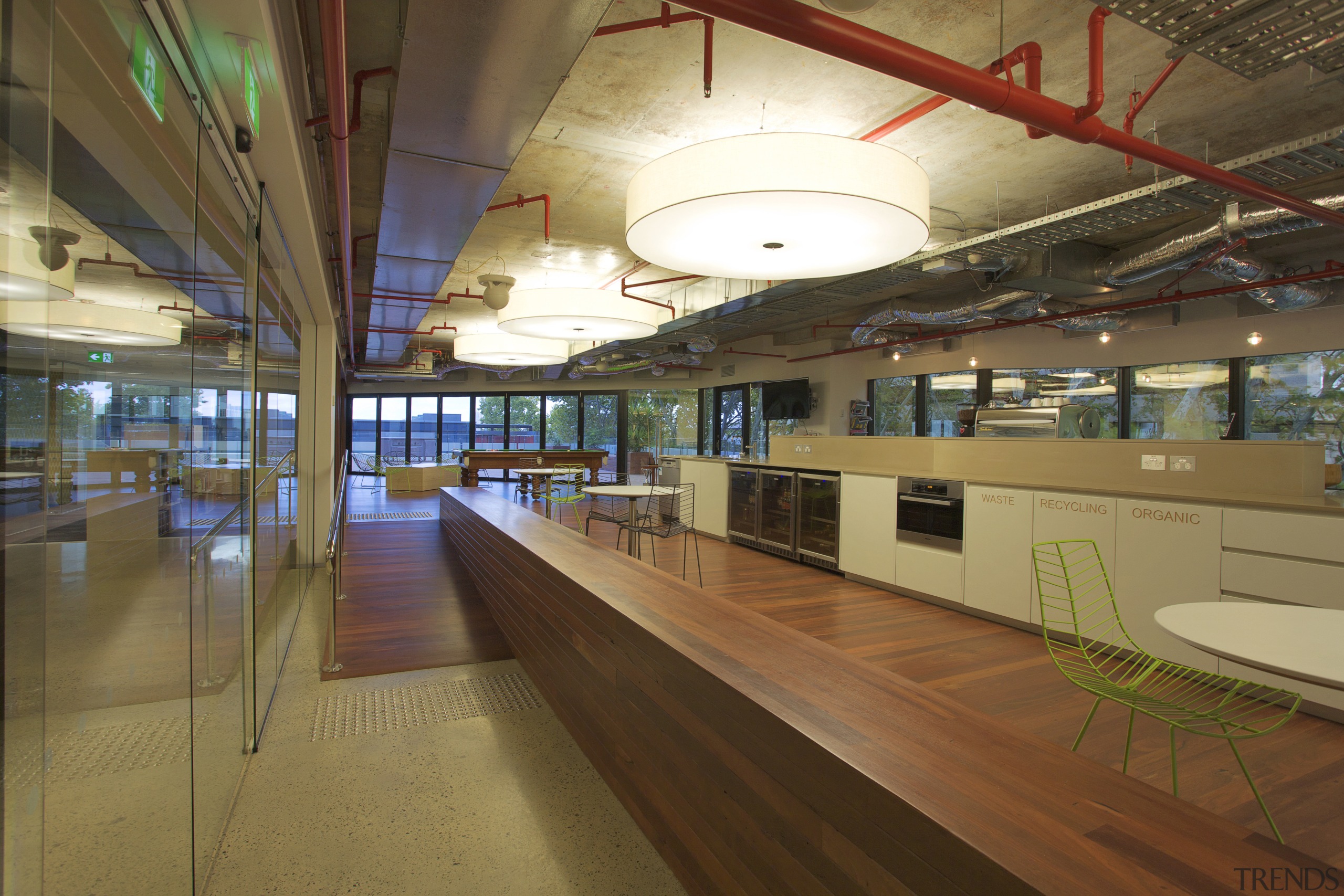 Interior with long wooden divider and exposed red interior design, leisure centre, brown