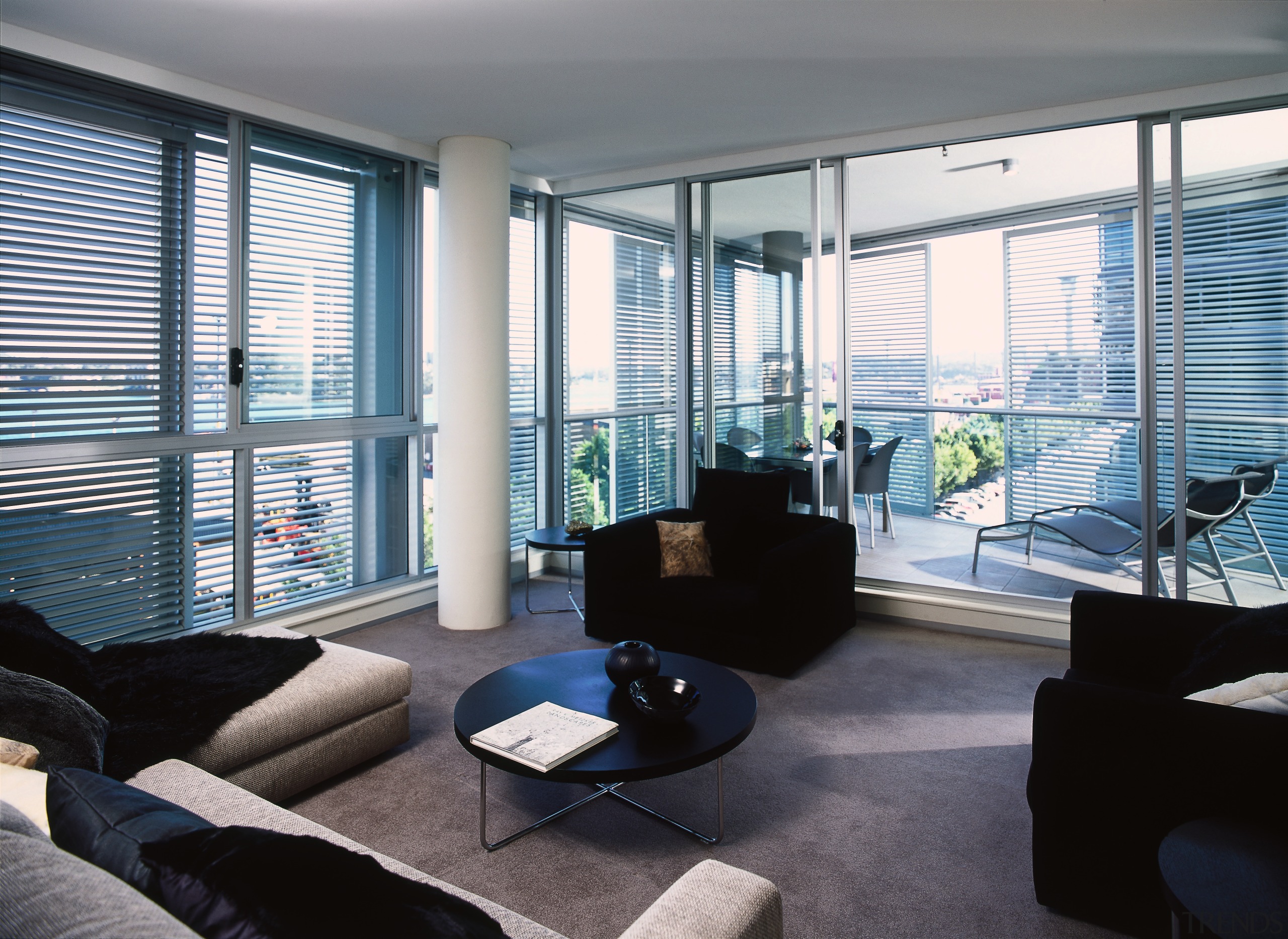 Apartment interior with grey carpet, cream sofas, black apartment, architecture, condominium, daylighting, house, interior design, living room, loft, penthouse apartment, property, real estate, shade, window, window blind, window covering, window treatment, gray, black