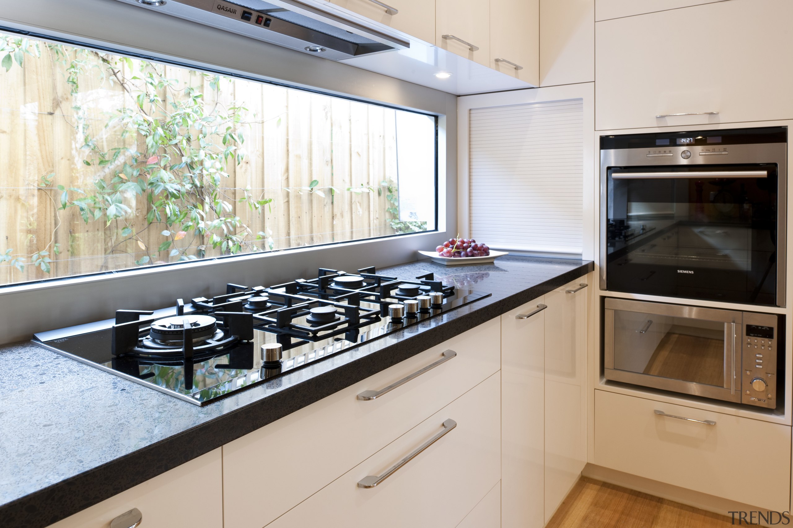 View of contemporary kitchen with white cabinetry and countertop, home appliance, kitchen, white