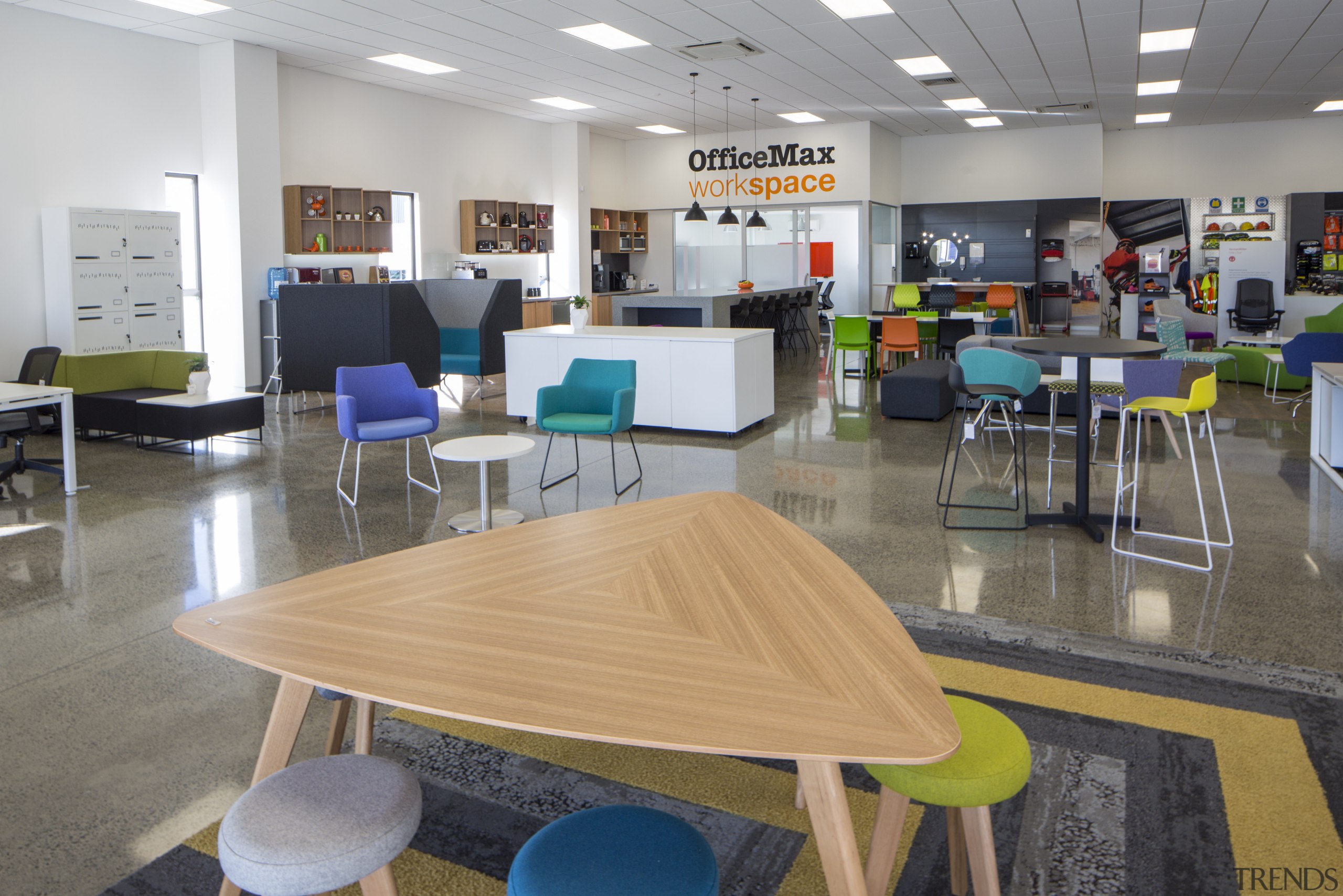 The Christchurch OfficeMax workspace store includes bright and chair, classroom, furniture, institution, interior design, office, table, gray