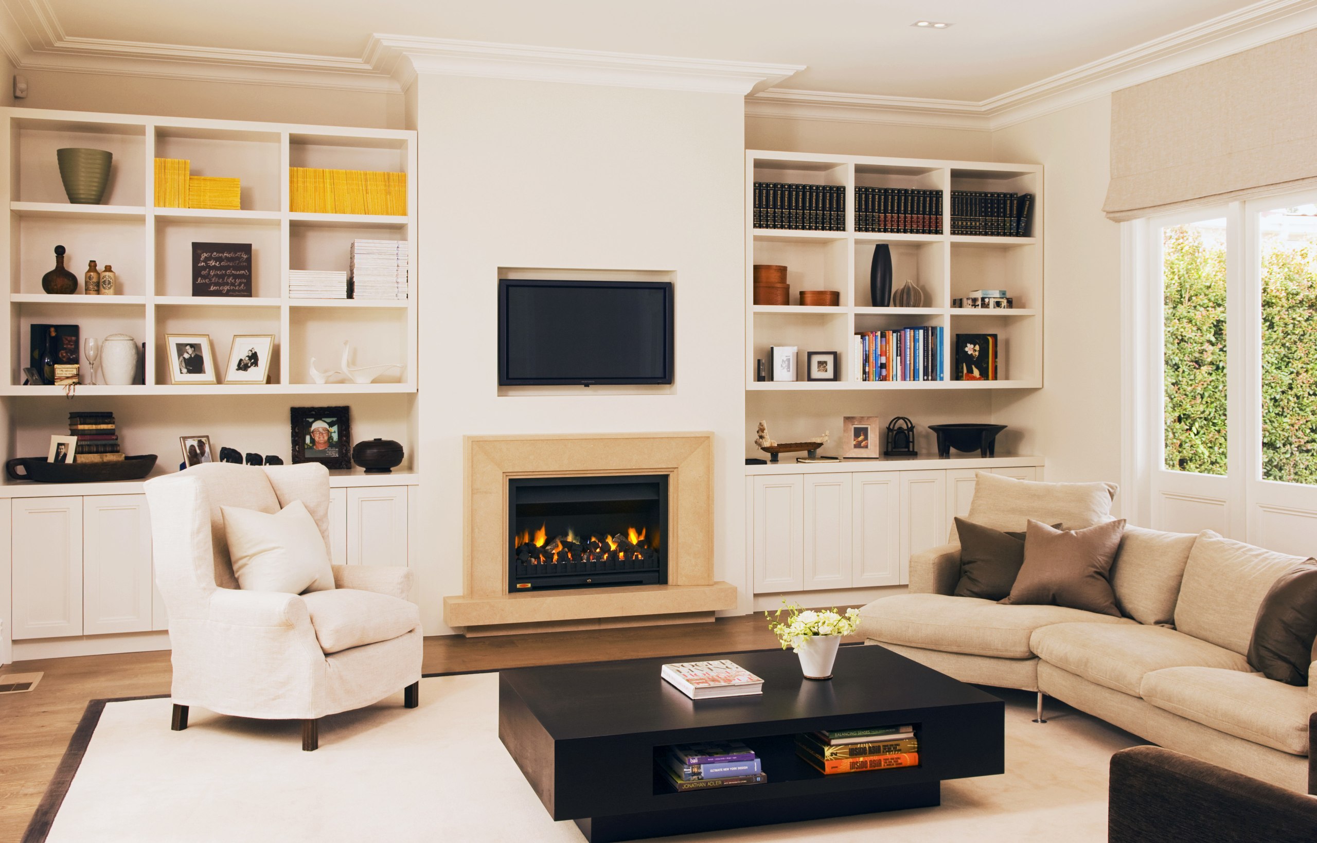 This newly renovated Herne Bay home features a furniture, hearth, home, interior design, living room, room, shelving, white, orange