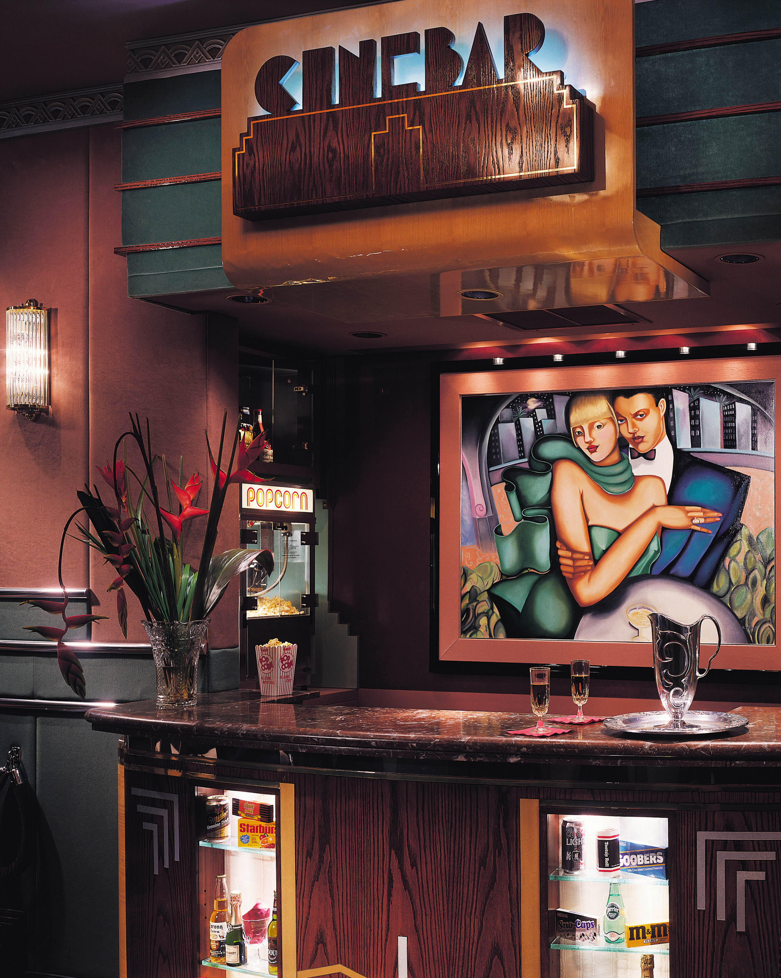 view of the themed cinebar featuring stained timber interior design, black